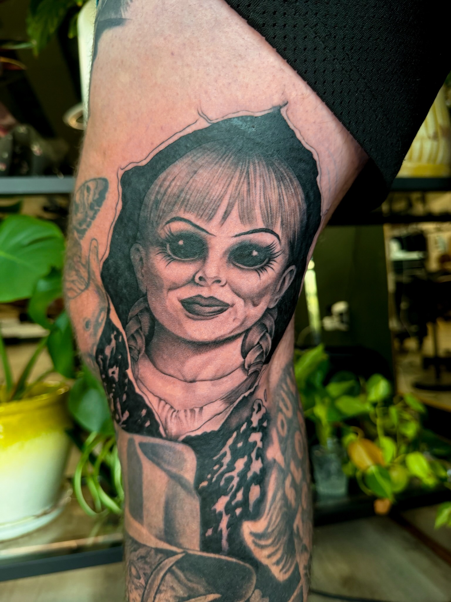 Doll head realism tattoo on the forearm by Sarah Margaret