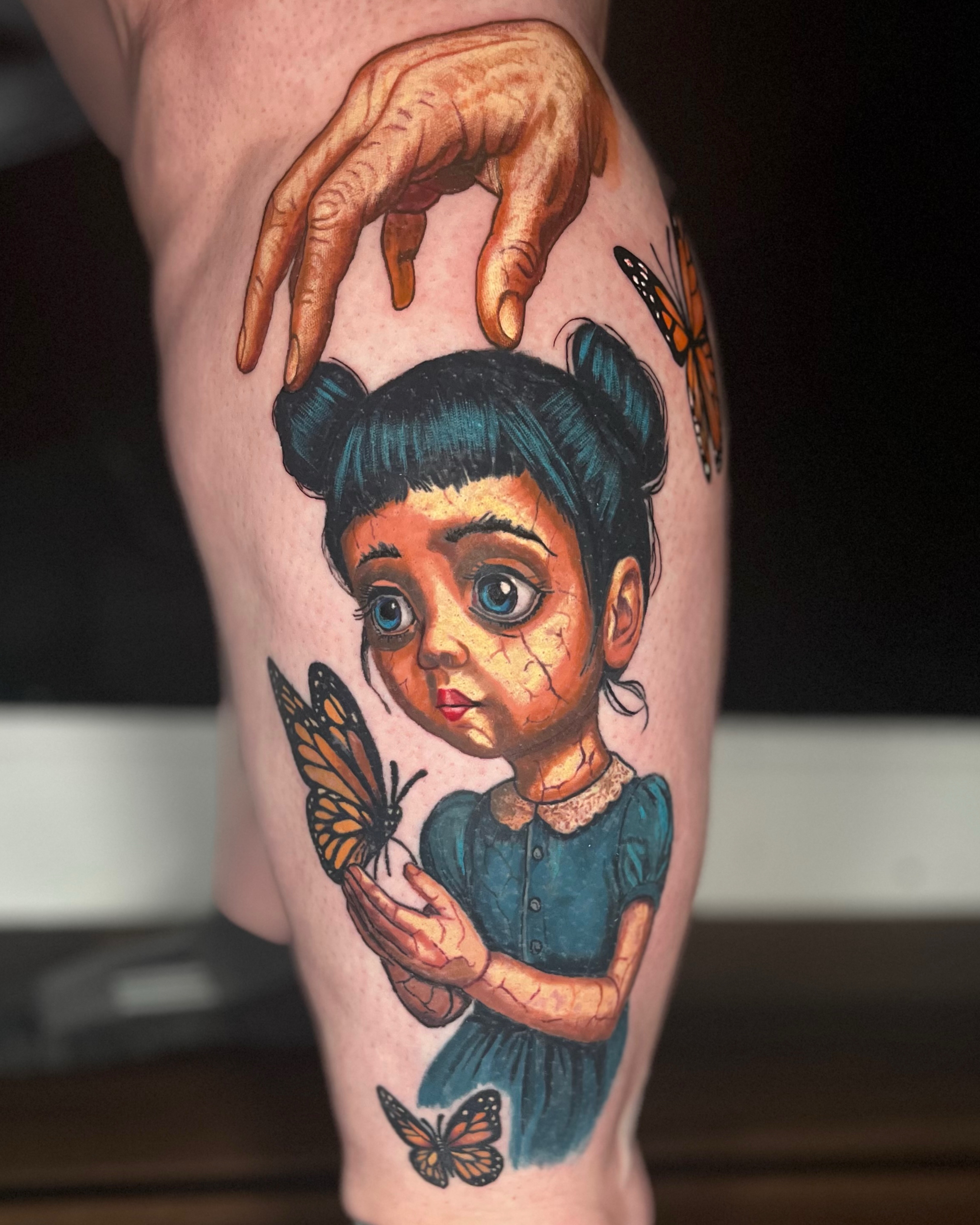 Girl with butterflies realism tattoo on the thigh by Ryan Hindenach