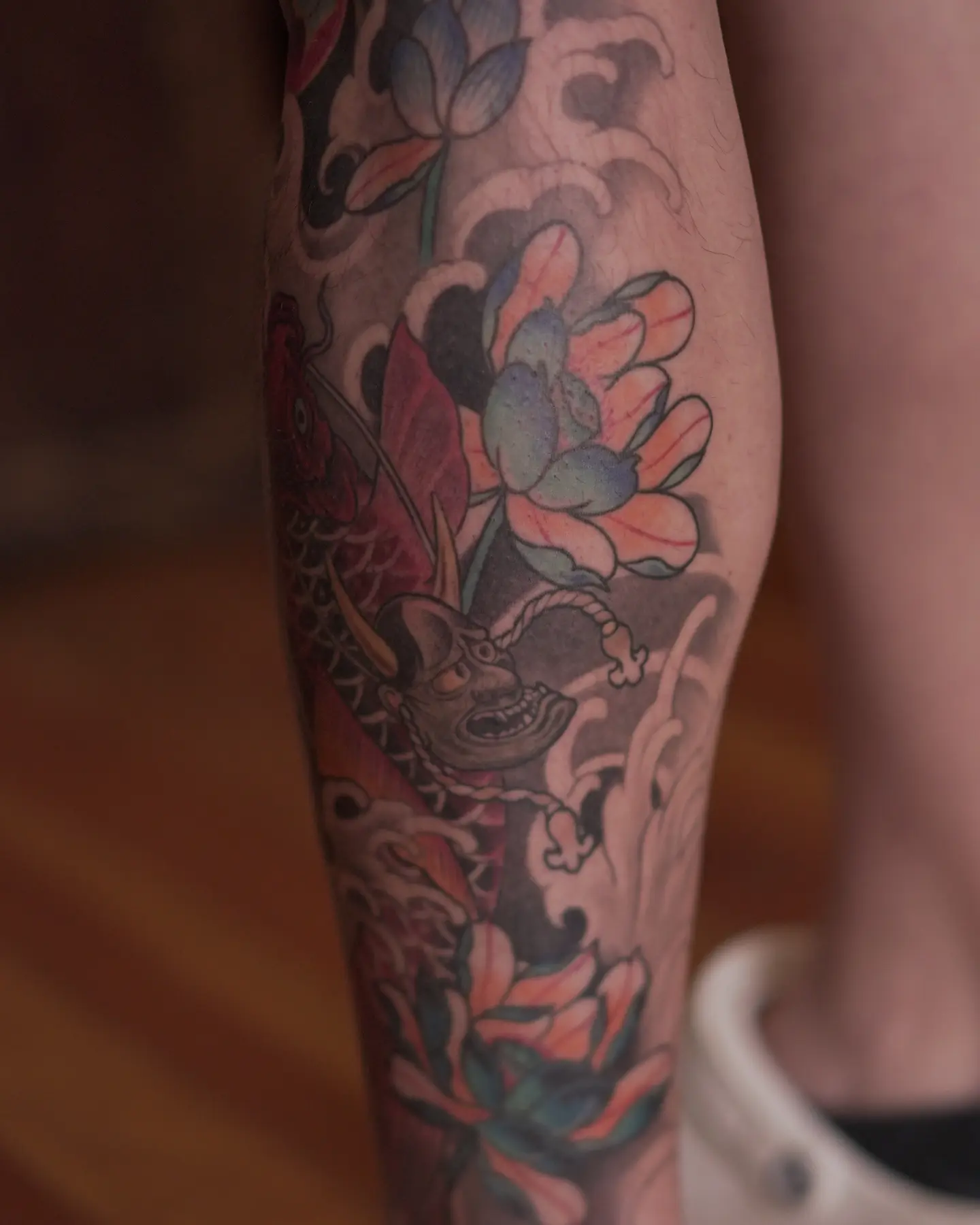 Floral and demonic mask japanese irezumi tattoo on the forearm by zamix_traditional, San Francisco, California