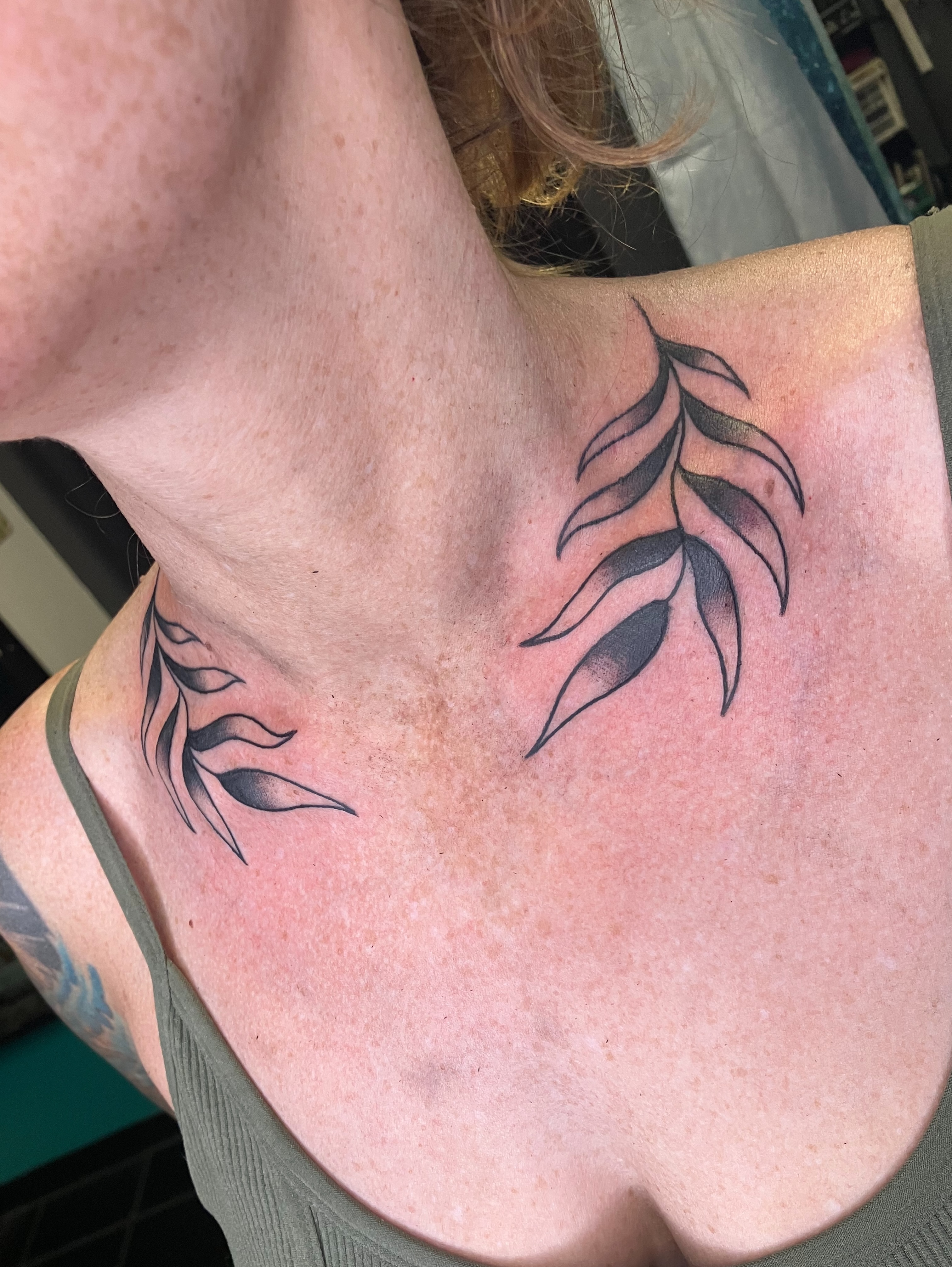 Feather black and grey tattoo on the chest by maddie mcghee, Memphis, Tennessee
