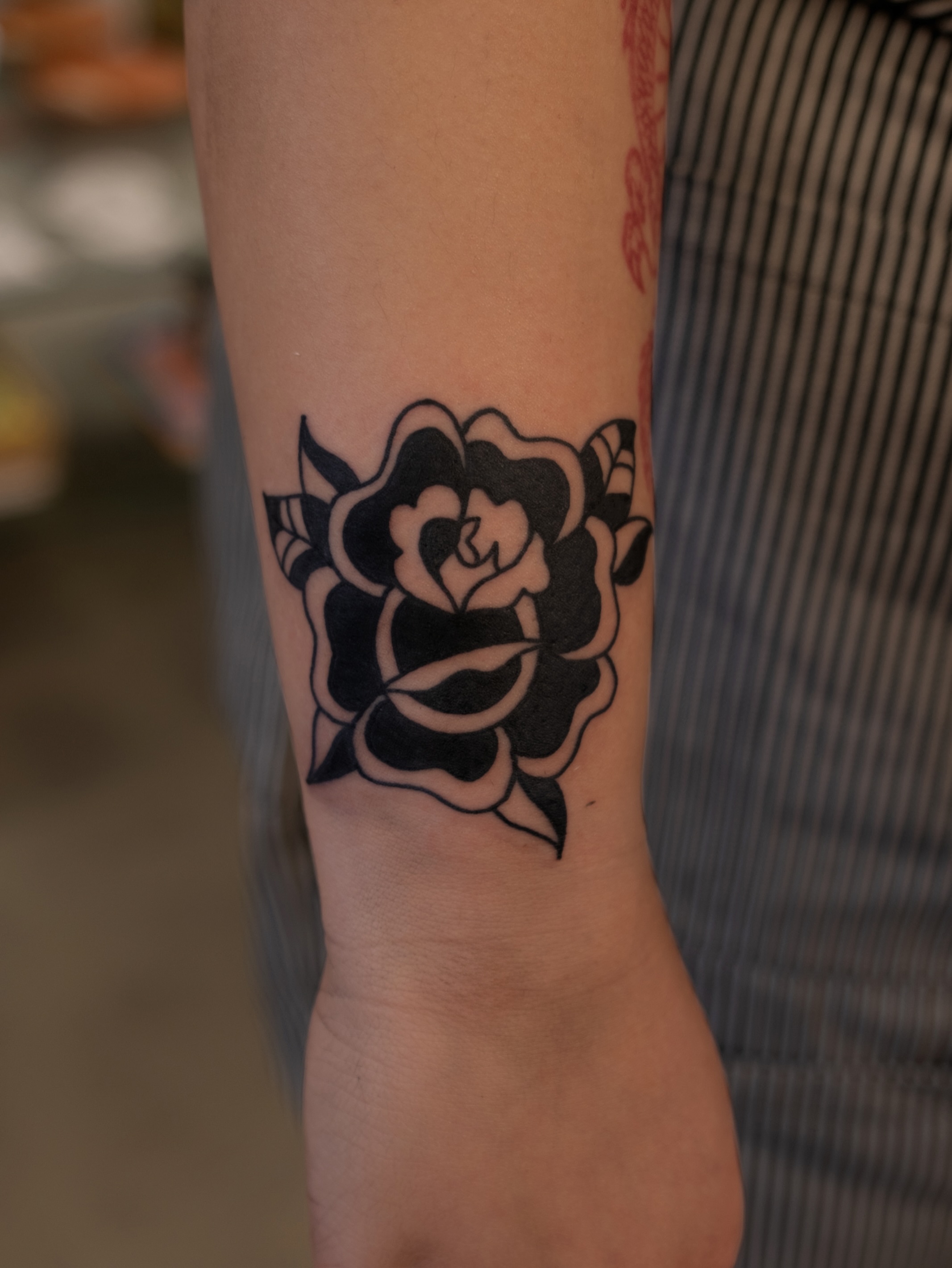 Rose black and grey tattoo on the forearm by Neto Velasco - Sad Cat Tattoo, Austin, Texas