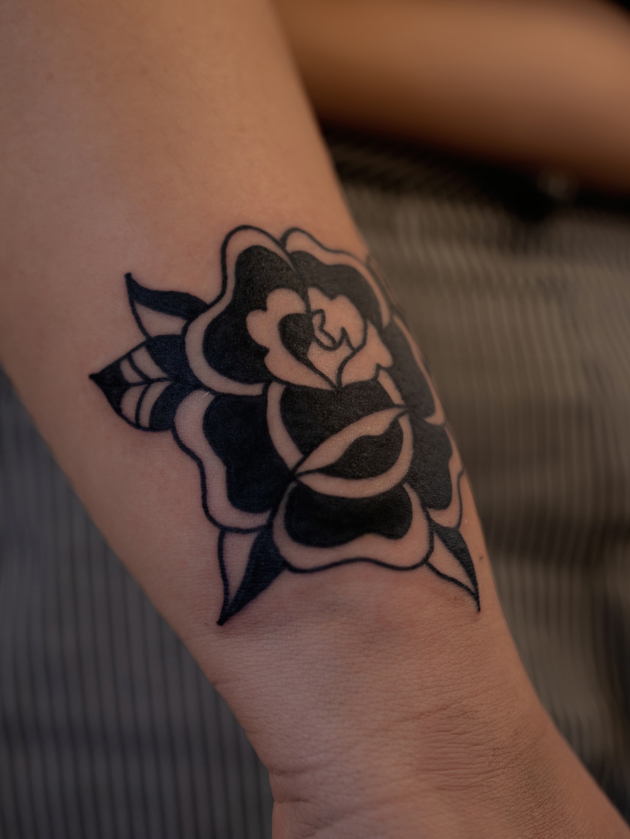 Rose black and grey tattoo on the forearm by Neto Velasco - Sad Cat Tattoo, Austin, Texas