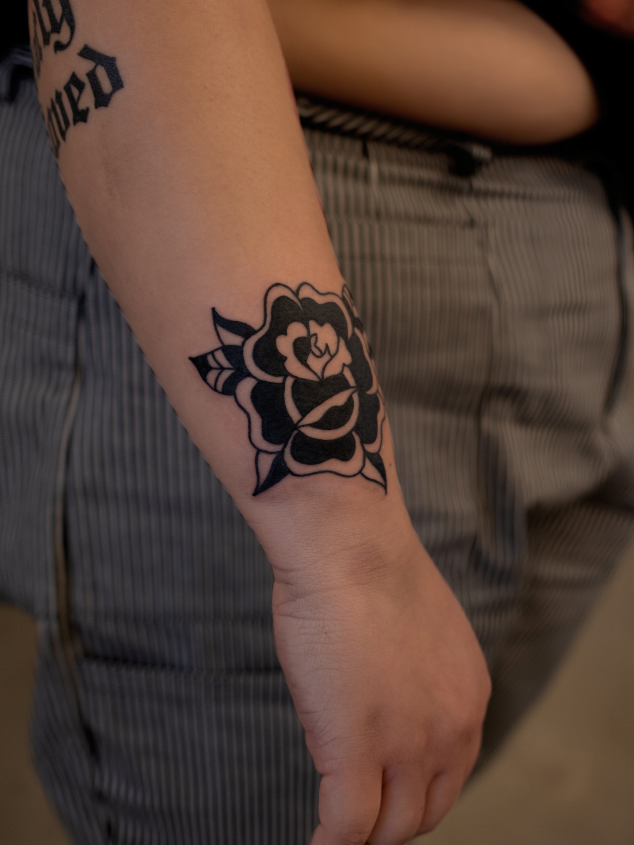 Rose black and grey tattoo on the forearm by Neto Velasco - Sad Cat Tattoo, Austin, Texas
