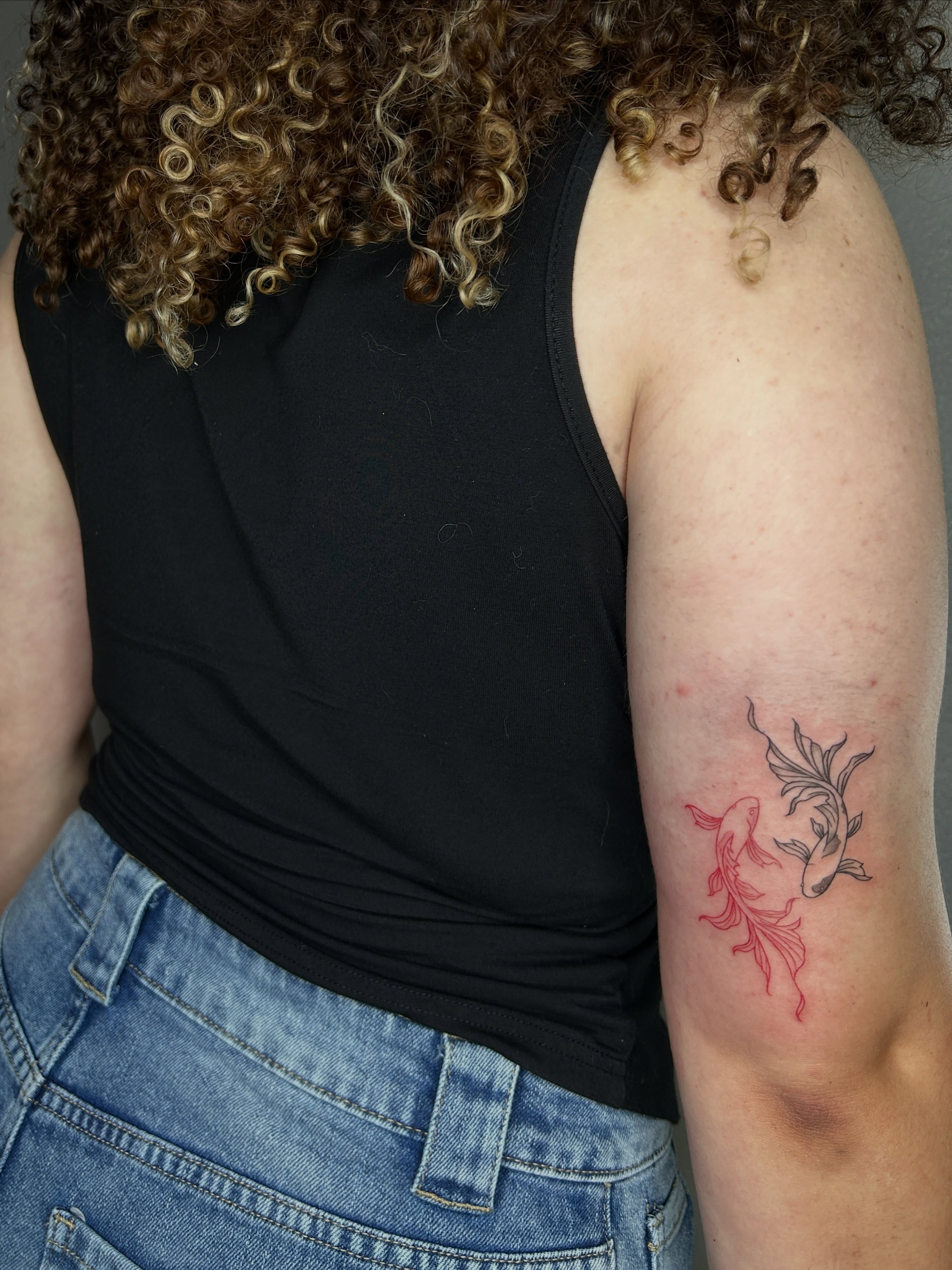 Koi fish black and grey tattoo on the forearm by @tattoosbyskyeee