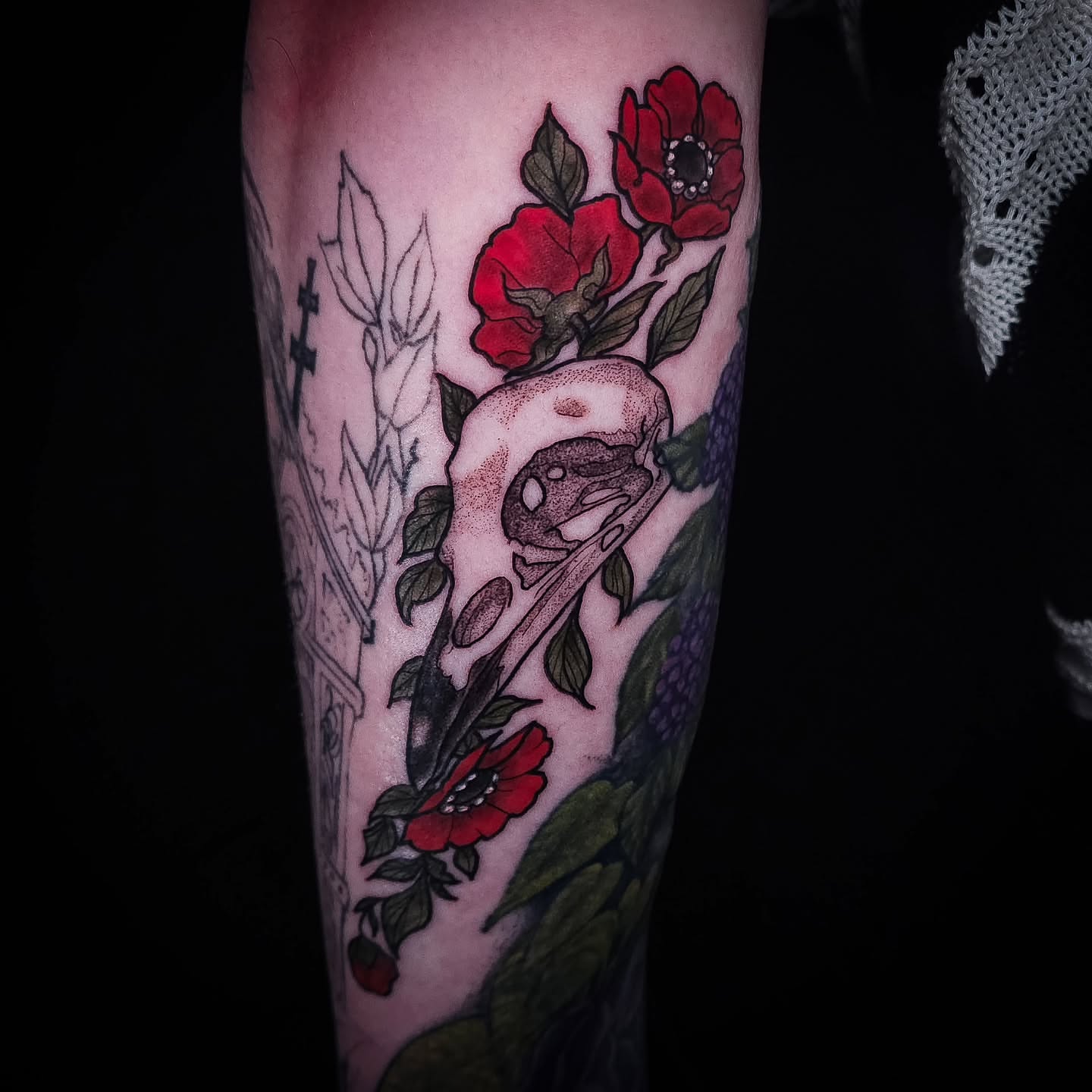 Skull and roses American traditional tattoo on the forearm by Eva the Tattoo Fartist in Seattle, WA, Seattle, Washington