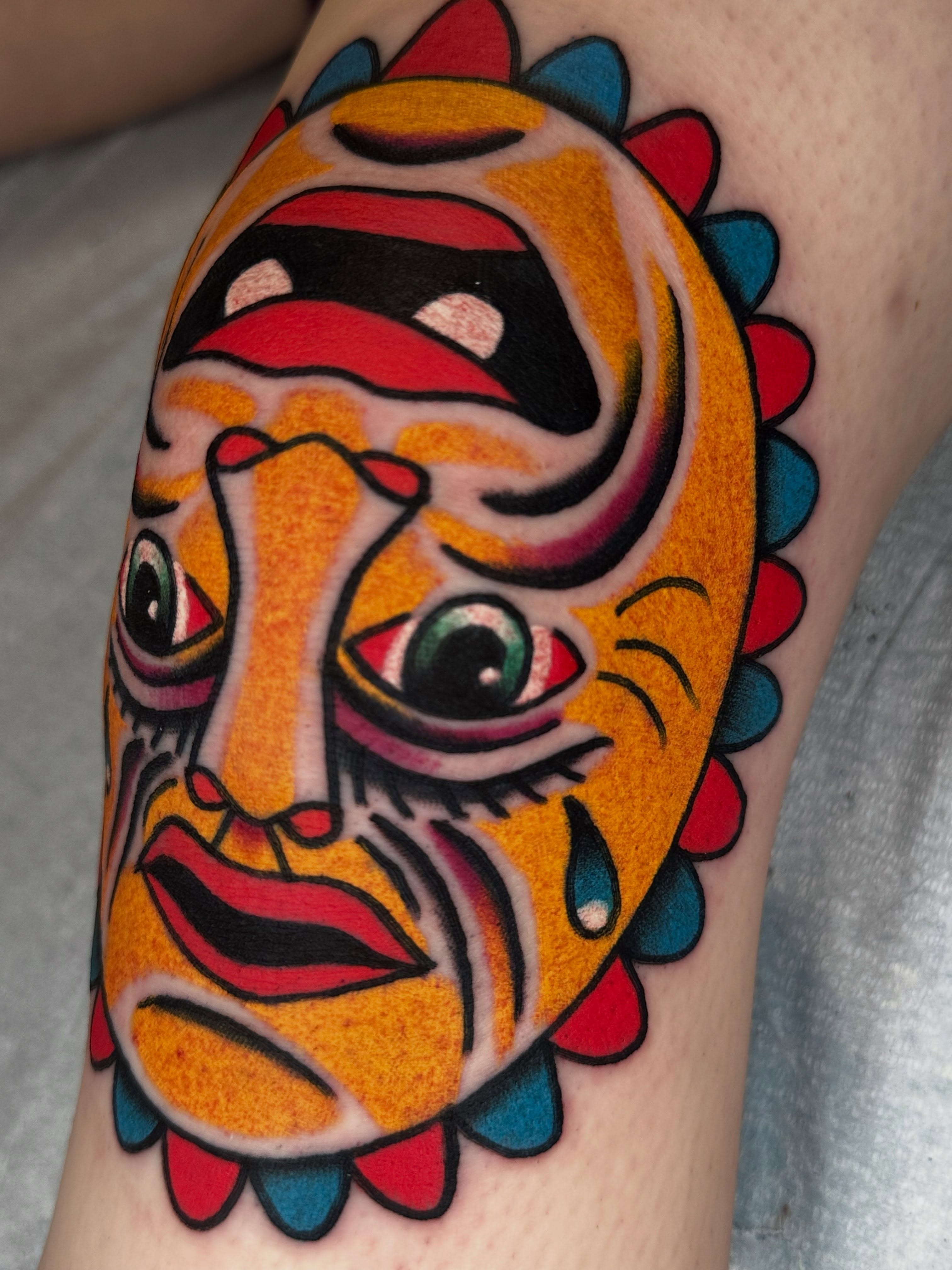 Mask American traditional tattoo on the forearm by Spencer Crawford, Speedway, Indiana
