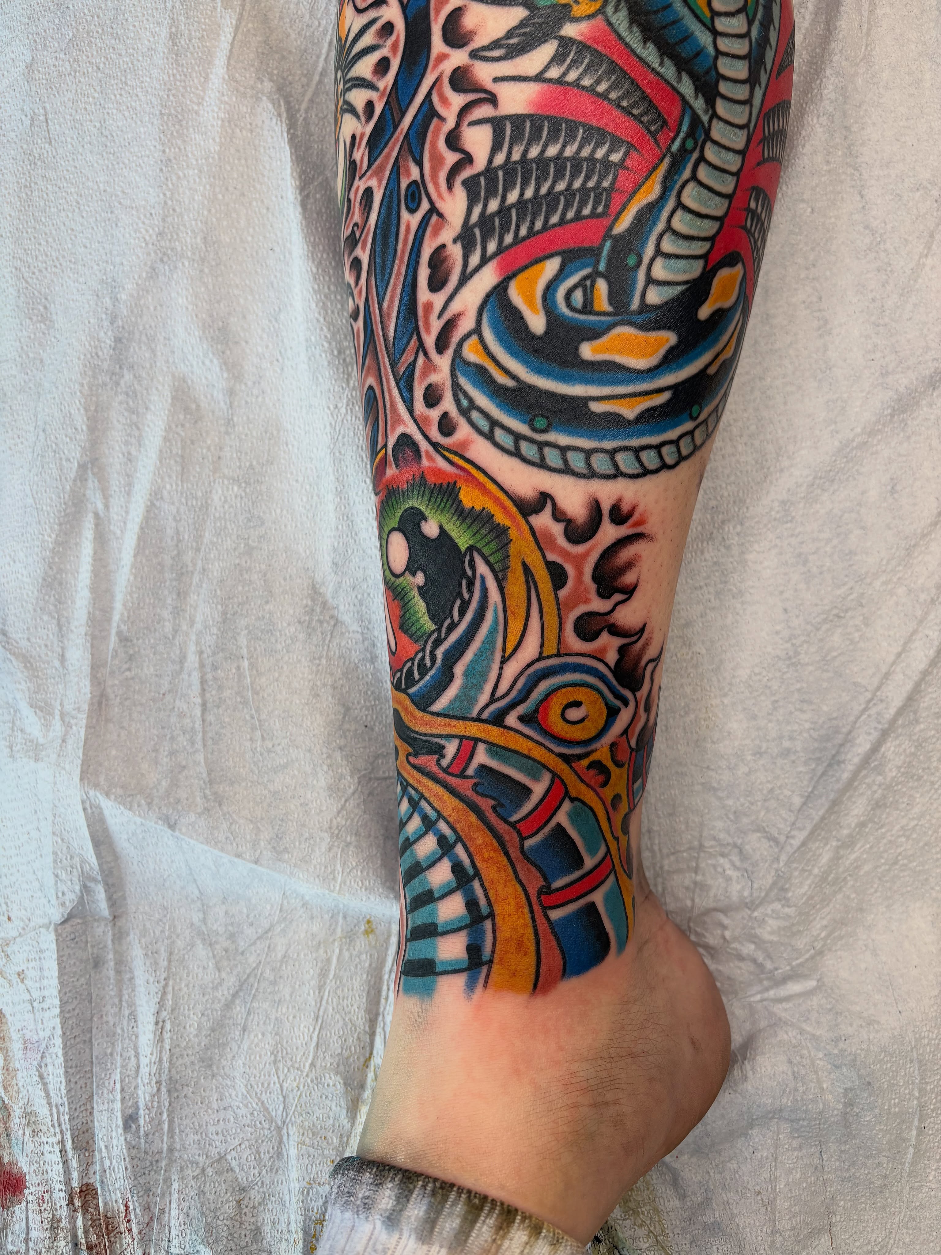 Mechanical gears and eyes geometric tattoo on the calf by Dallas Tattoo Artist
