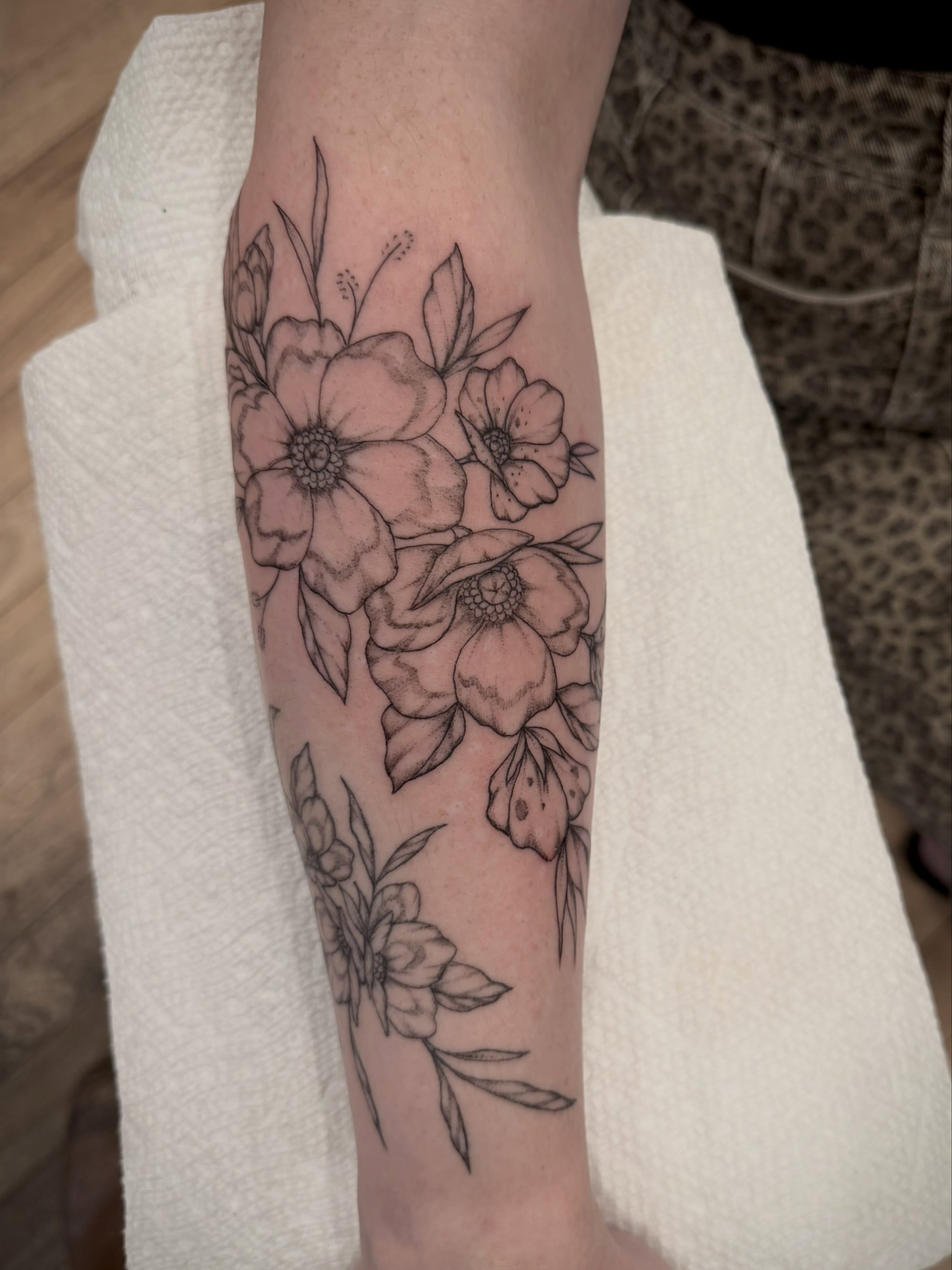 Flowers black and grey tattoo on the forearm by Daniel Anthony, Philadelphia, Pennsylvania