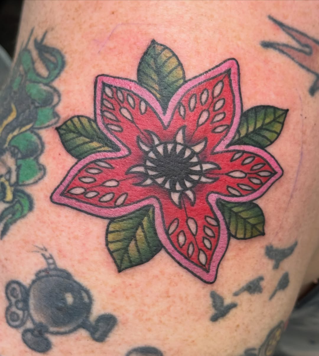 Watermelon slice American traditional tattoo on the upper arm by Michael Roehrich (MEECH!)