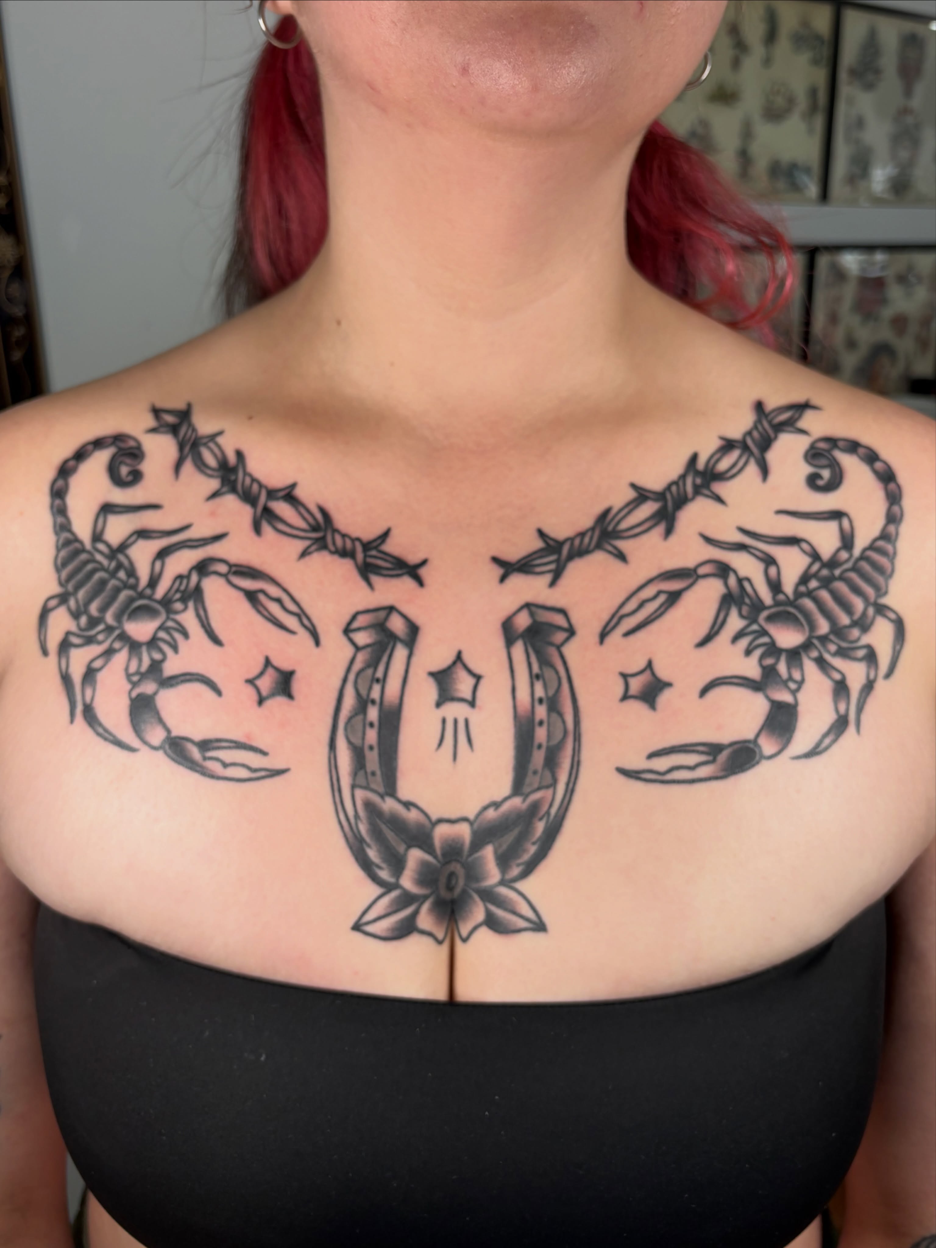 Scorpio and horseshoe black and grey tattoo on the chest by Aysia Mankin-Wong, San Francisco, California