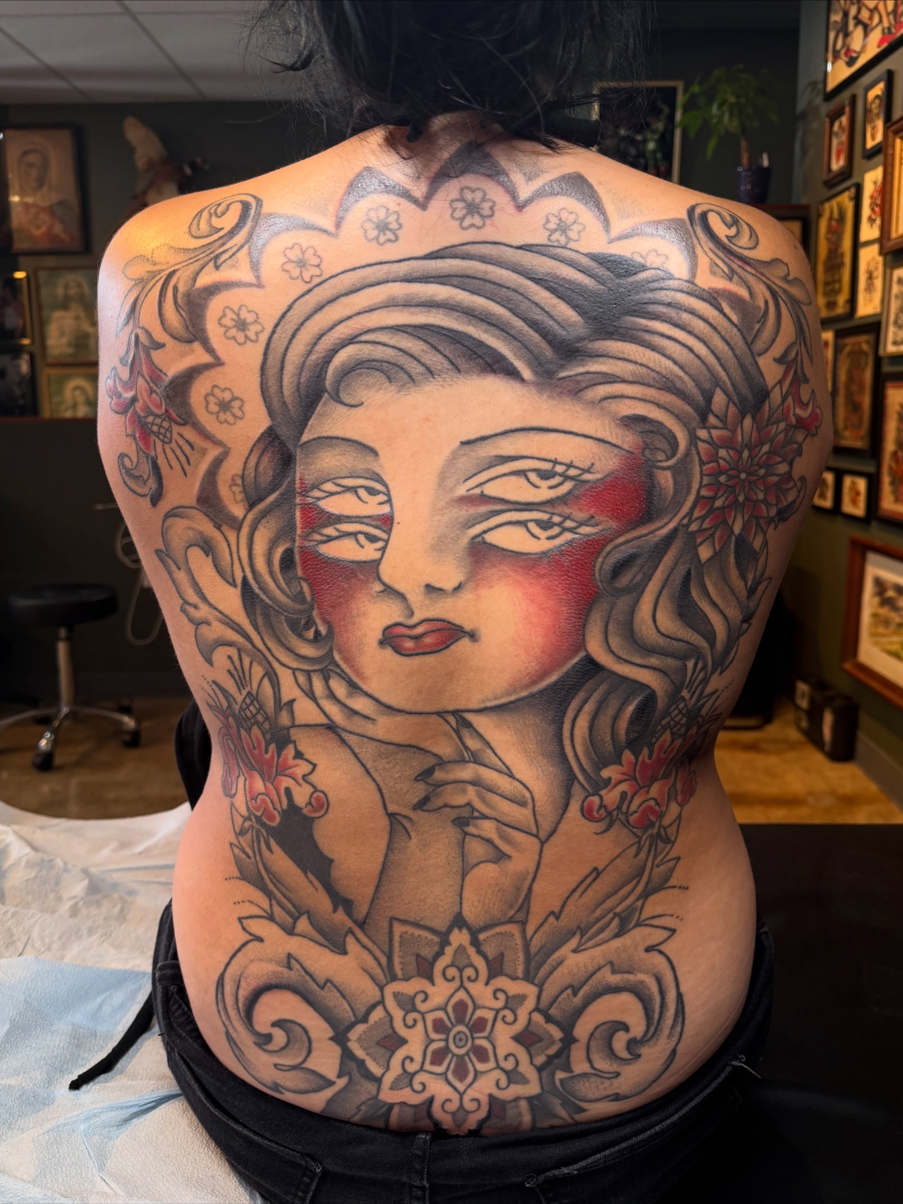 Woman's face American traditional tattoo on the back by Luisa Gonzalez, Austin, Texas