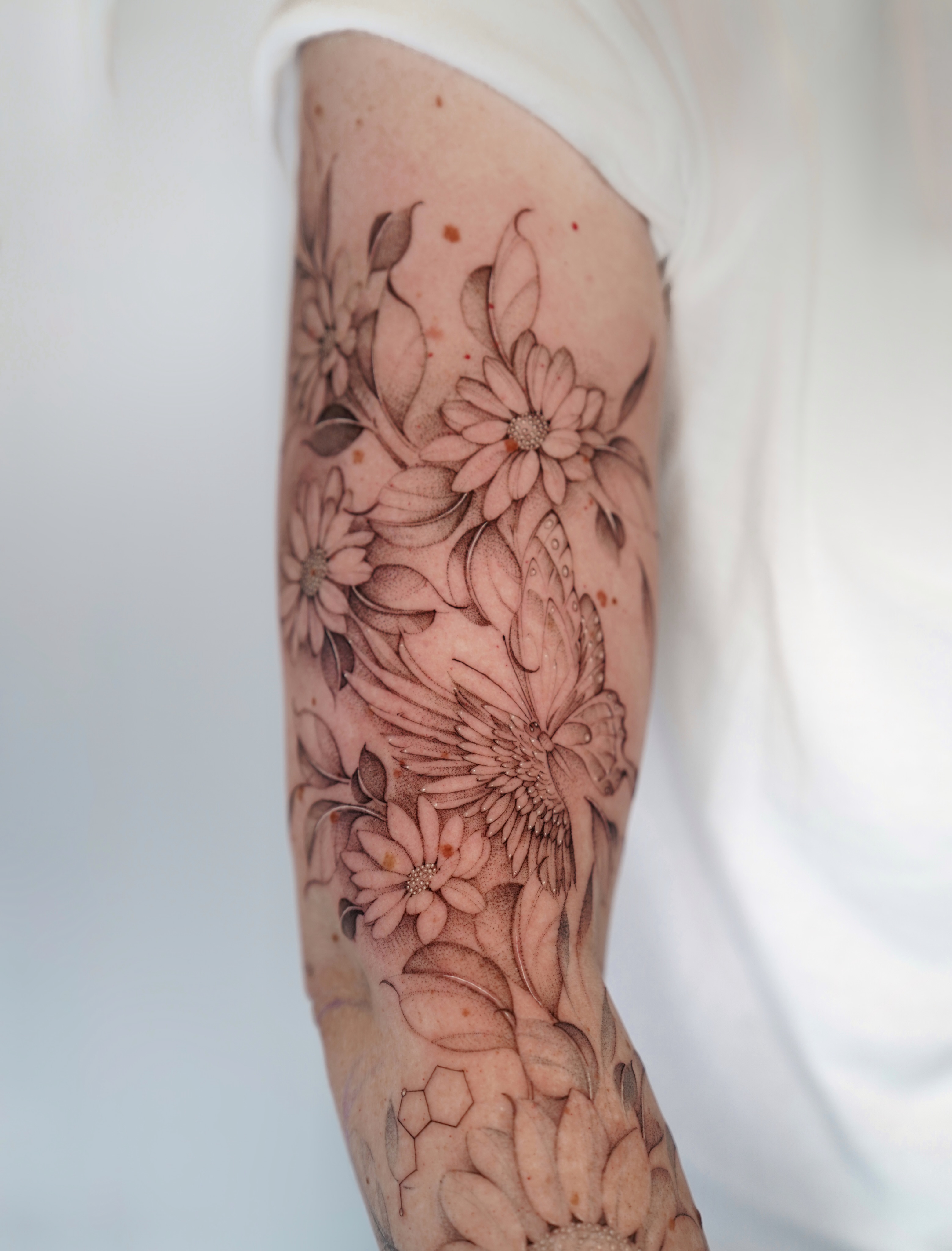Floral bouquet dotwork tattoo on the forearm by Bel Fernandez