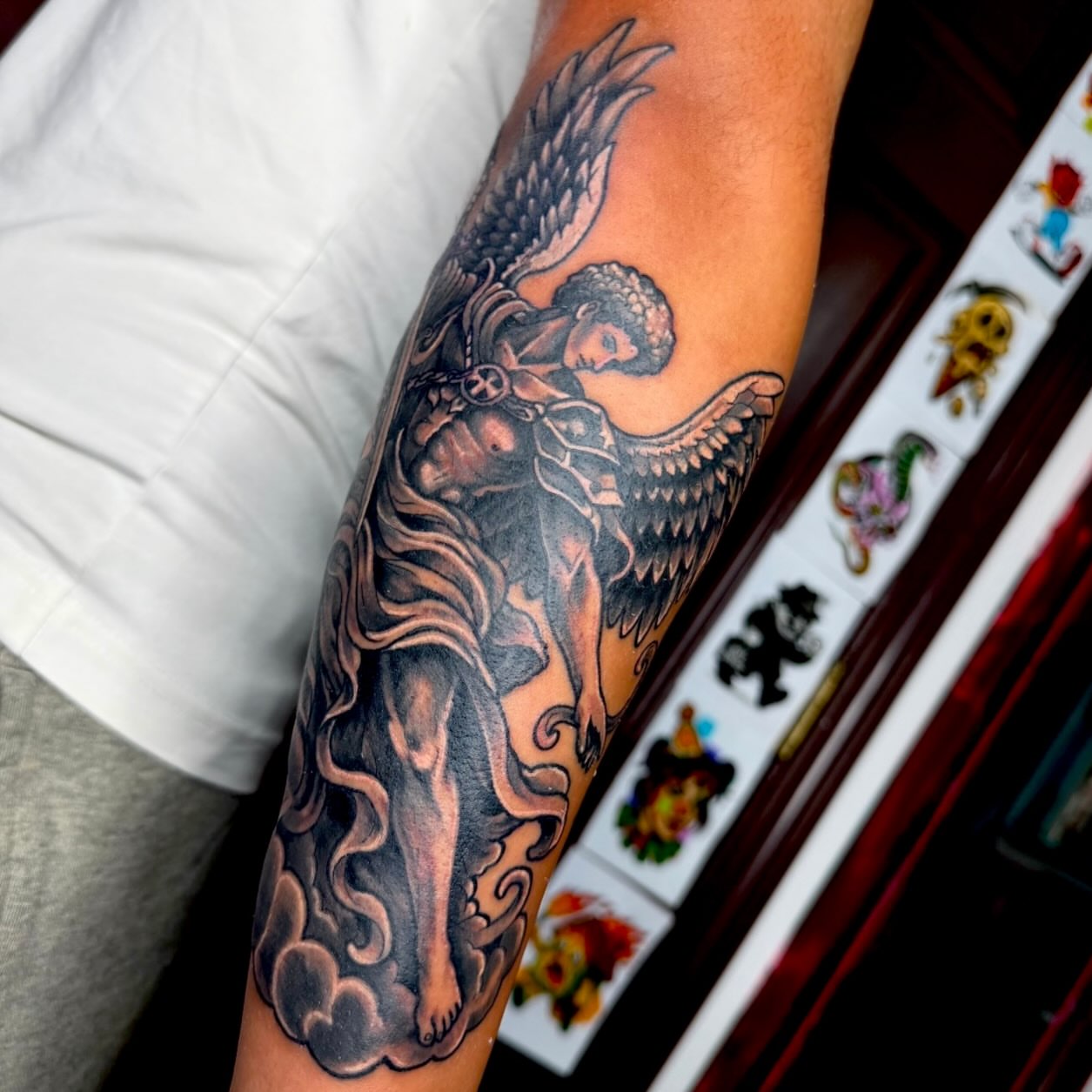 Angel with sword neo-traditional tattoo on the forearm by Michael Latendresse