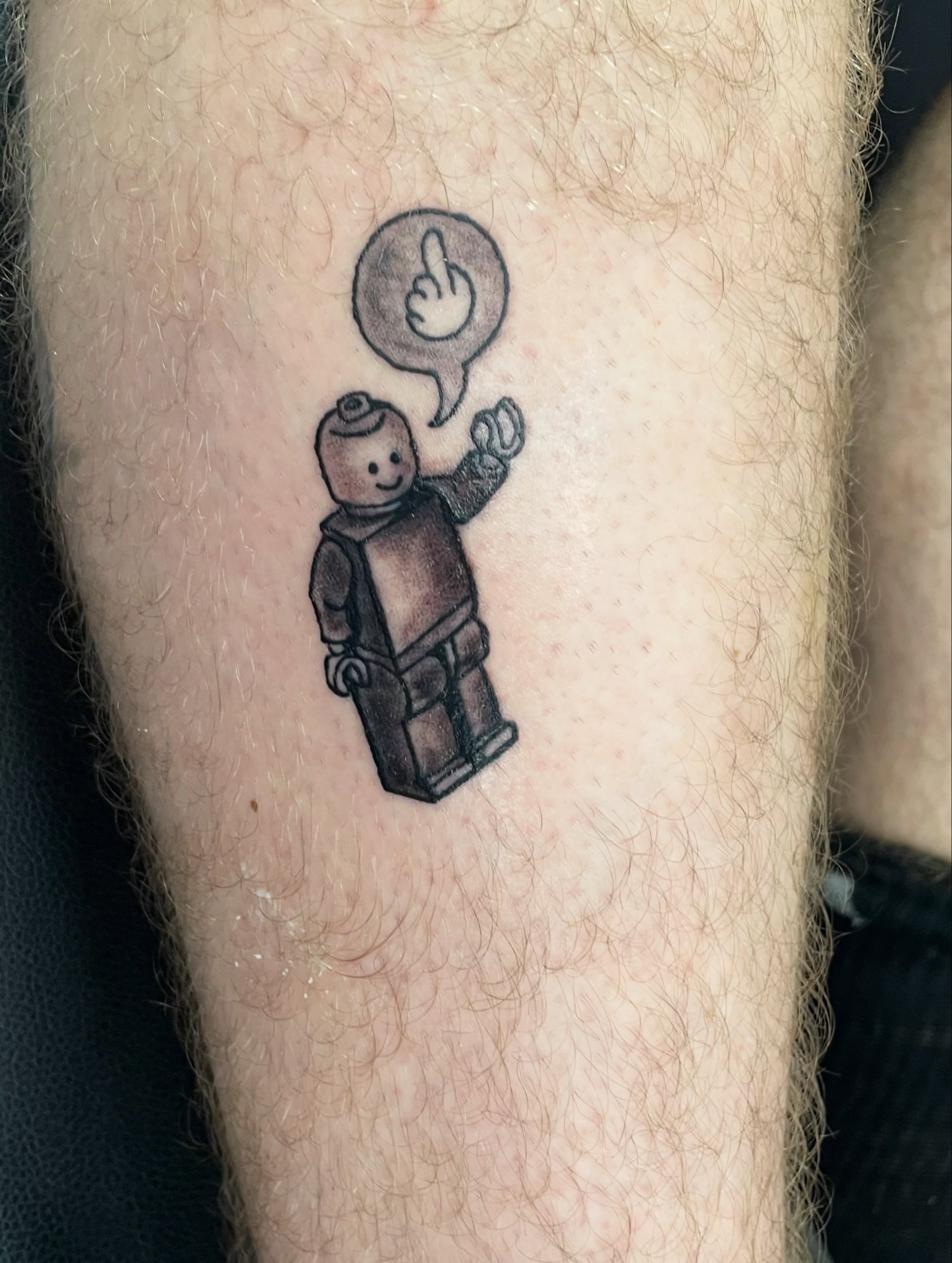 LEGO minifigure black and grey tattoo on the forearm by Michael David