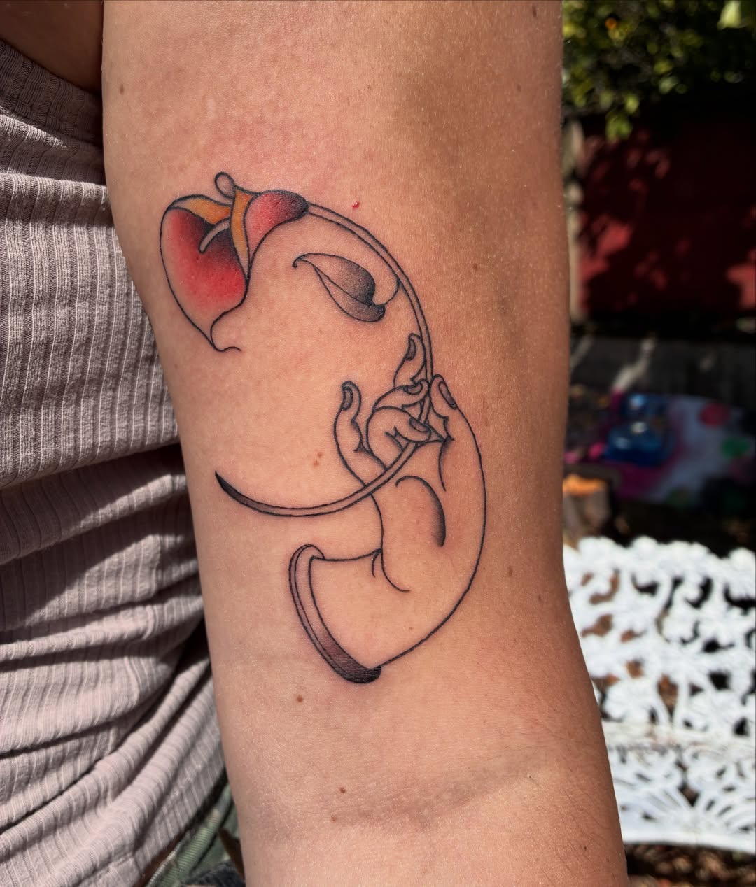 Uterus and fetus fine line tattoo on the forearm by Xin.H