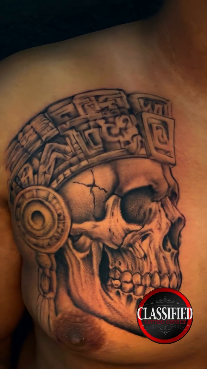 Aztec skull headdress realism tattoo by Cultura