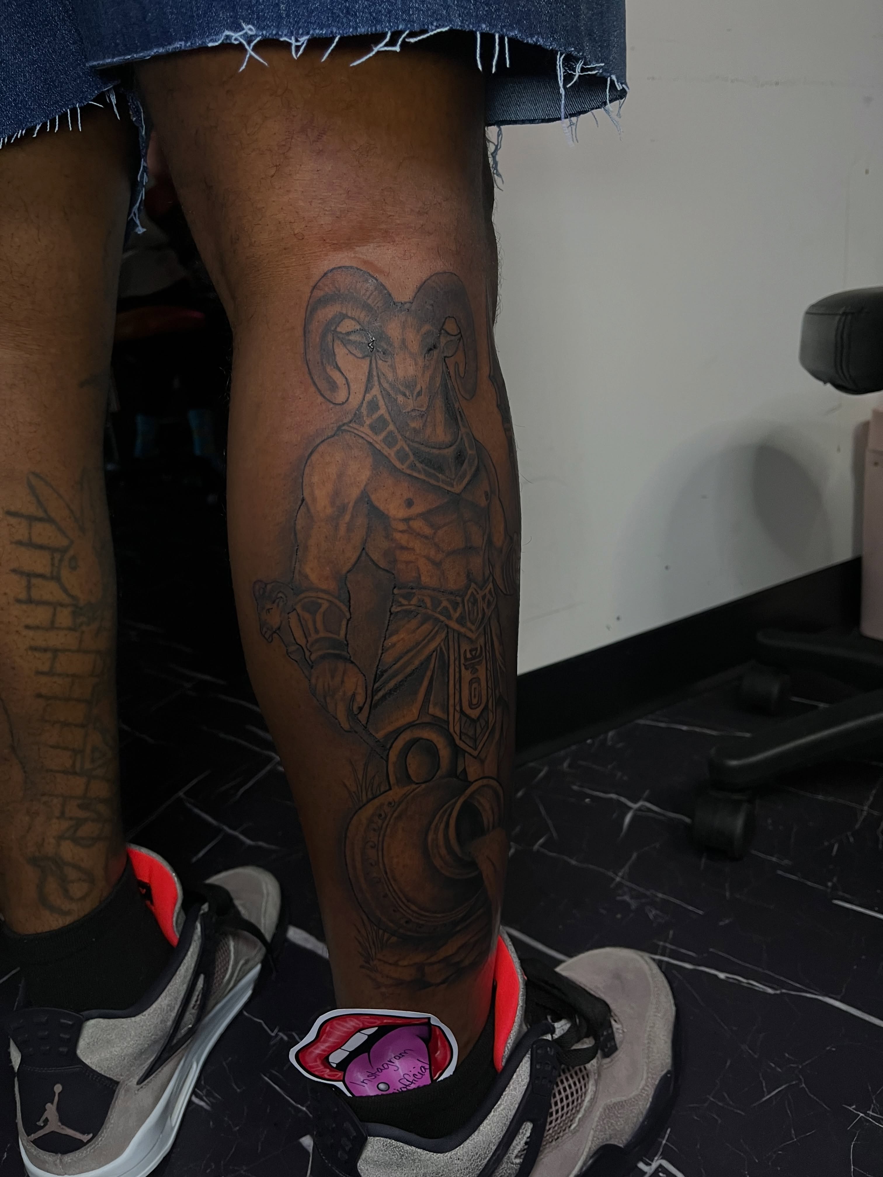 Ram warrior black and grey tattoo on the leg by Doll The Tattoo Artist, Addison, Texas