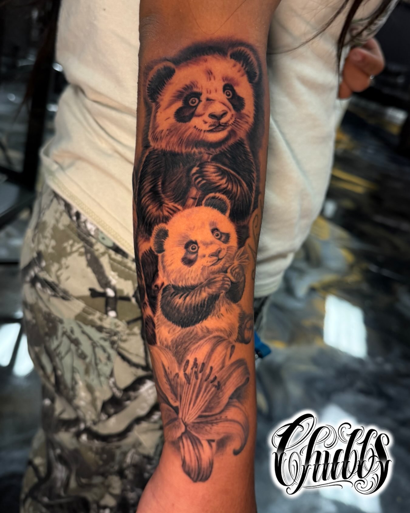 Pandas realism tattoo on the forearm by Chubbs