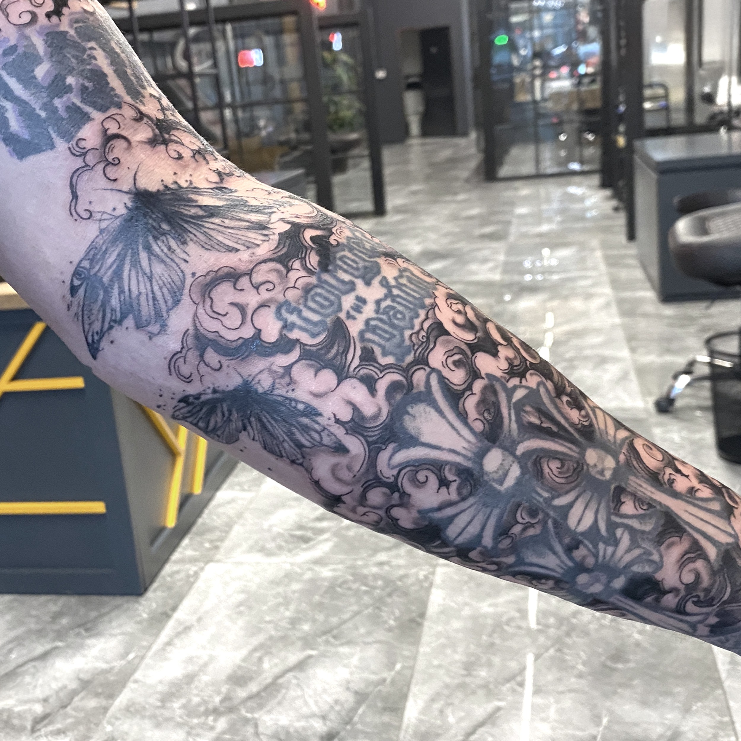 Butterflies and clouds ornamental tattoo on the forearm by R o s e