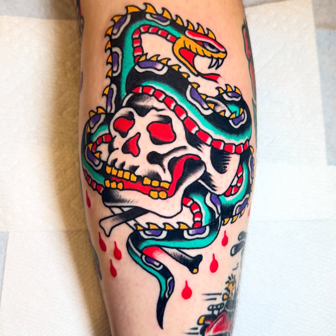 Skull with snake American traditional tattoo on the forearm by Rizzo