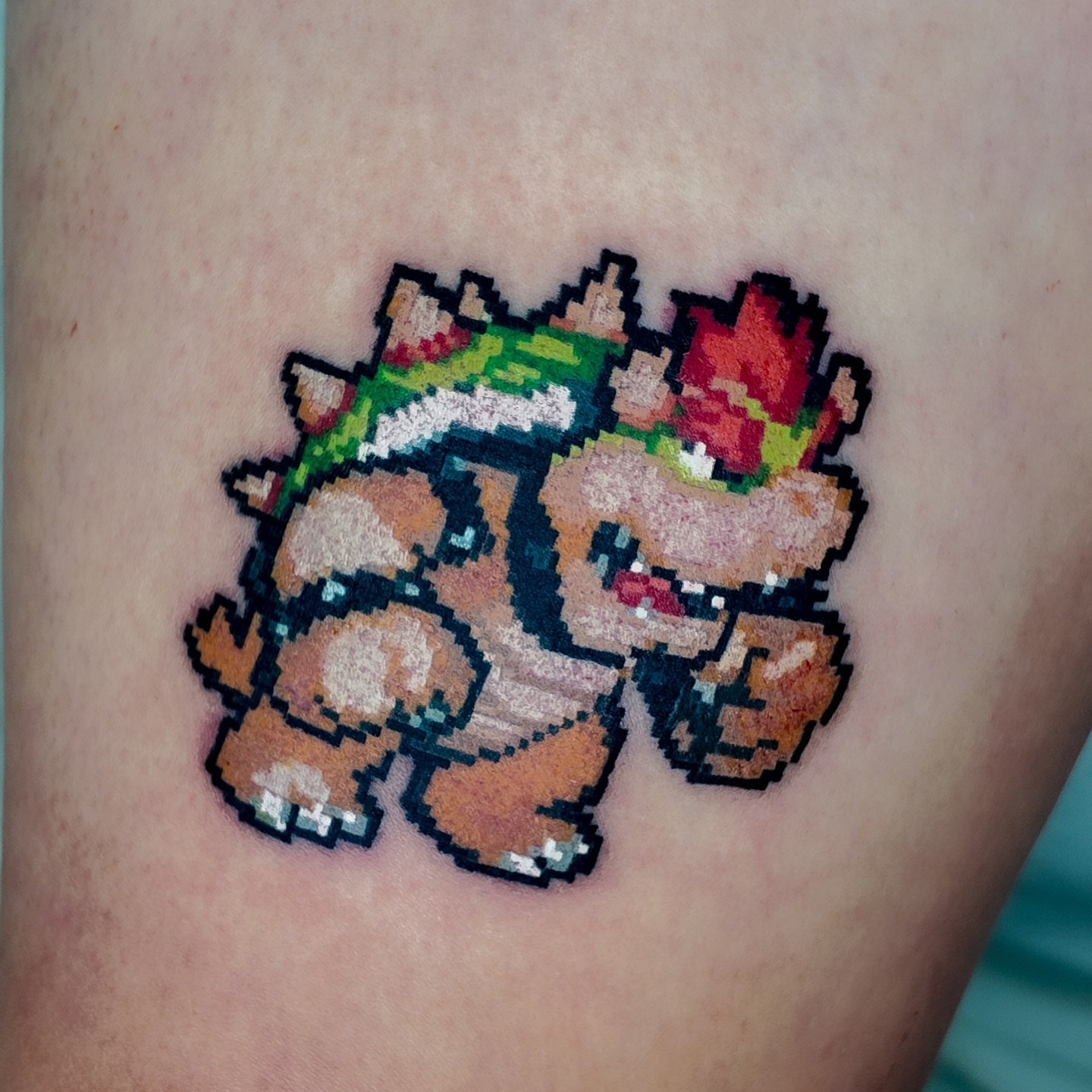 Pixel art character dotwork tattoo on the forearm by m r p i x e l ๐ธ๐ฌ