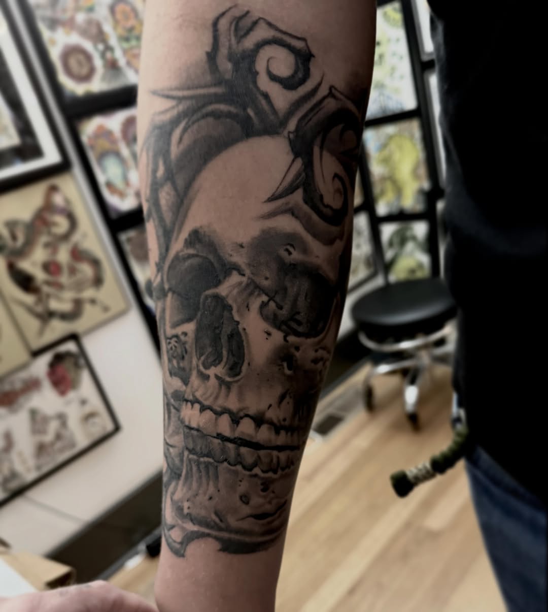 Skull realism tattoo on the forearm by Alex Rockoff