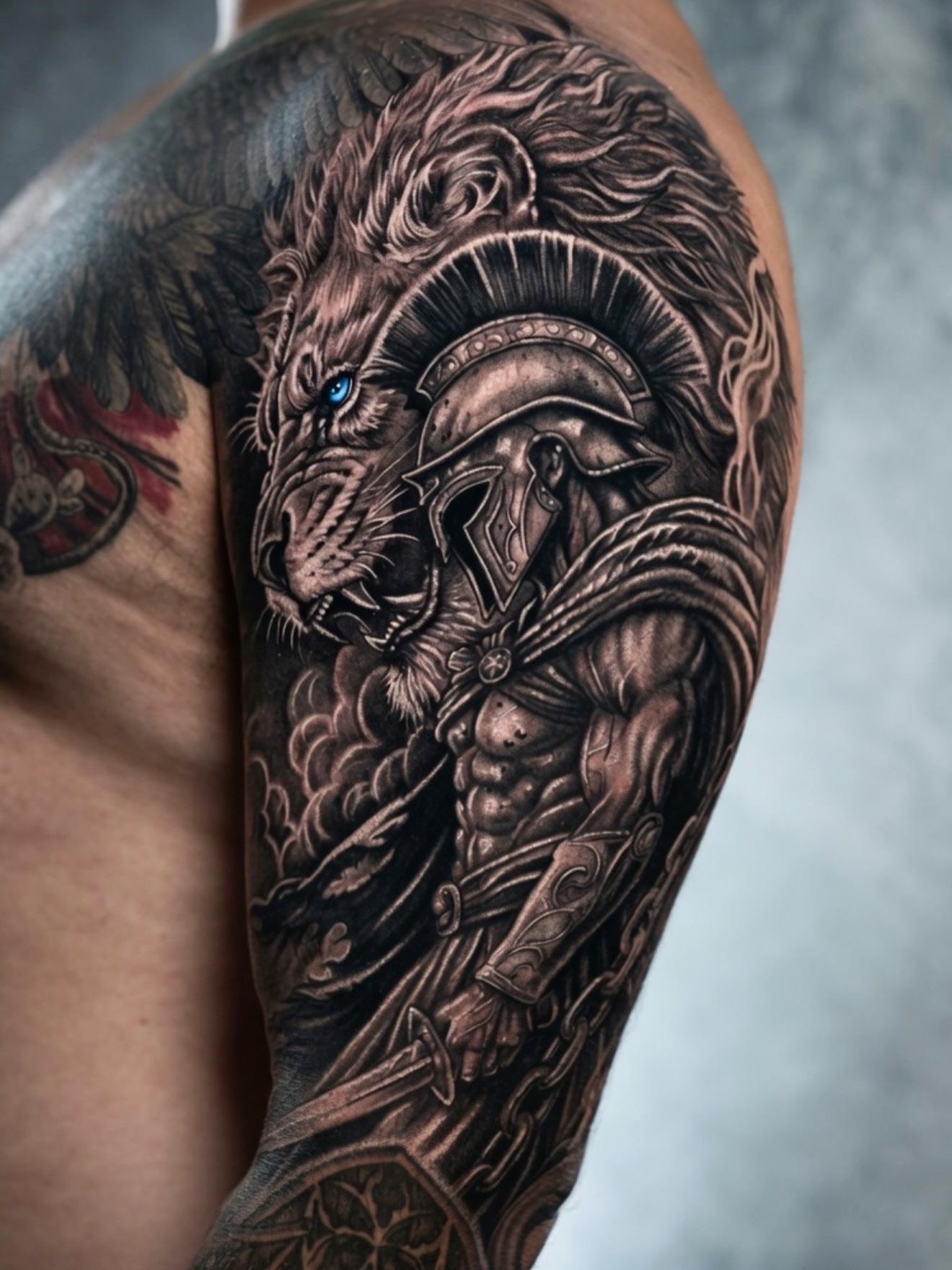 Lion and warrior realism tattoo on the shoulder by Henrry Bravo
