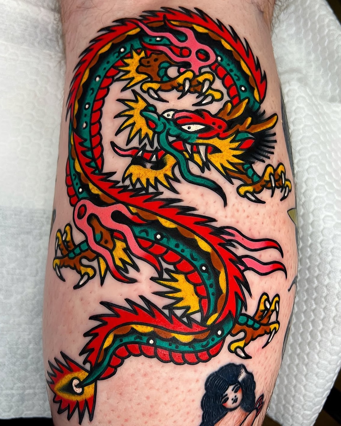 Dragon American traditional tattoo on the forearm by 올드스쿨타투 호무