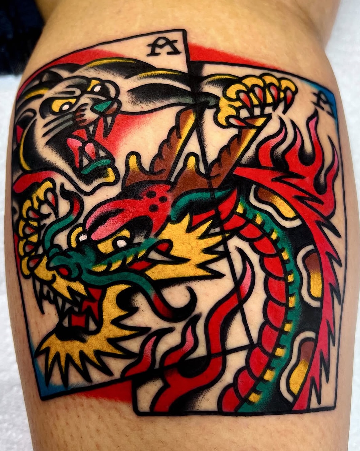Dragon and tiger American traditional tattoo on the thigh by 올드스쿨타투 호무