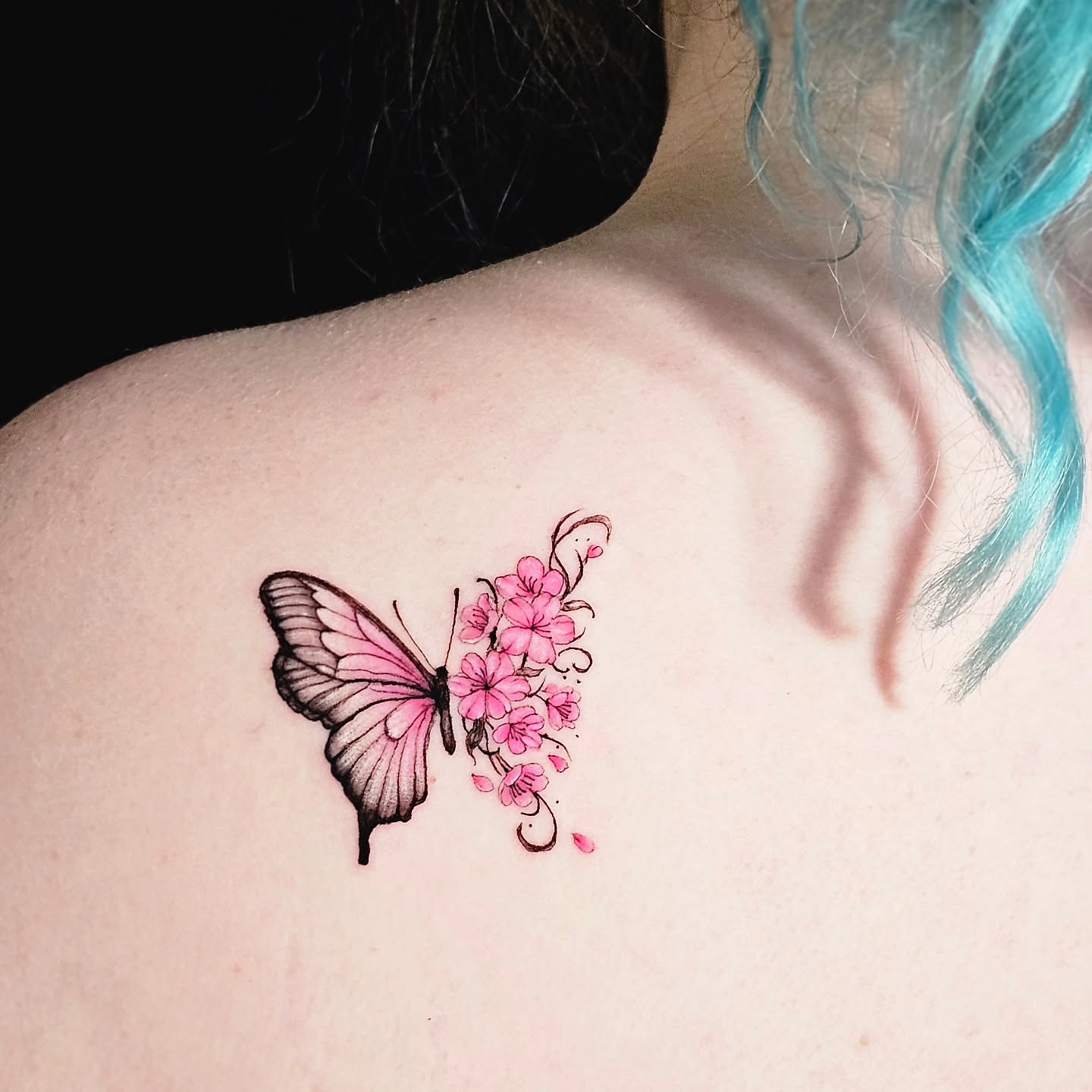 Butterfly and flowers watercolor tattoo on the shoulder by Lili Gu