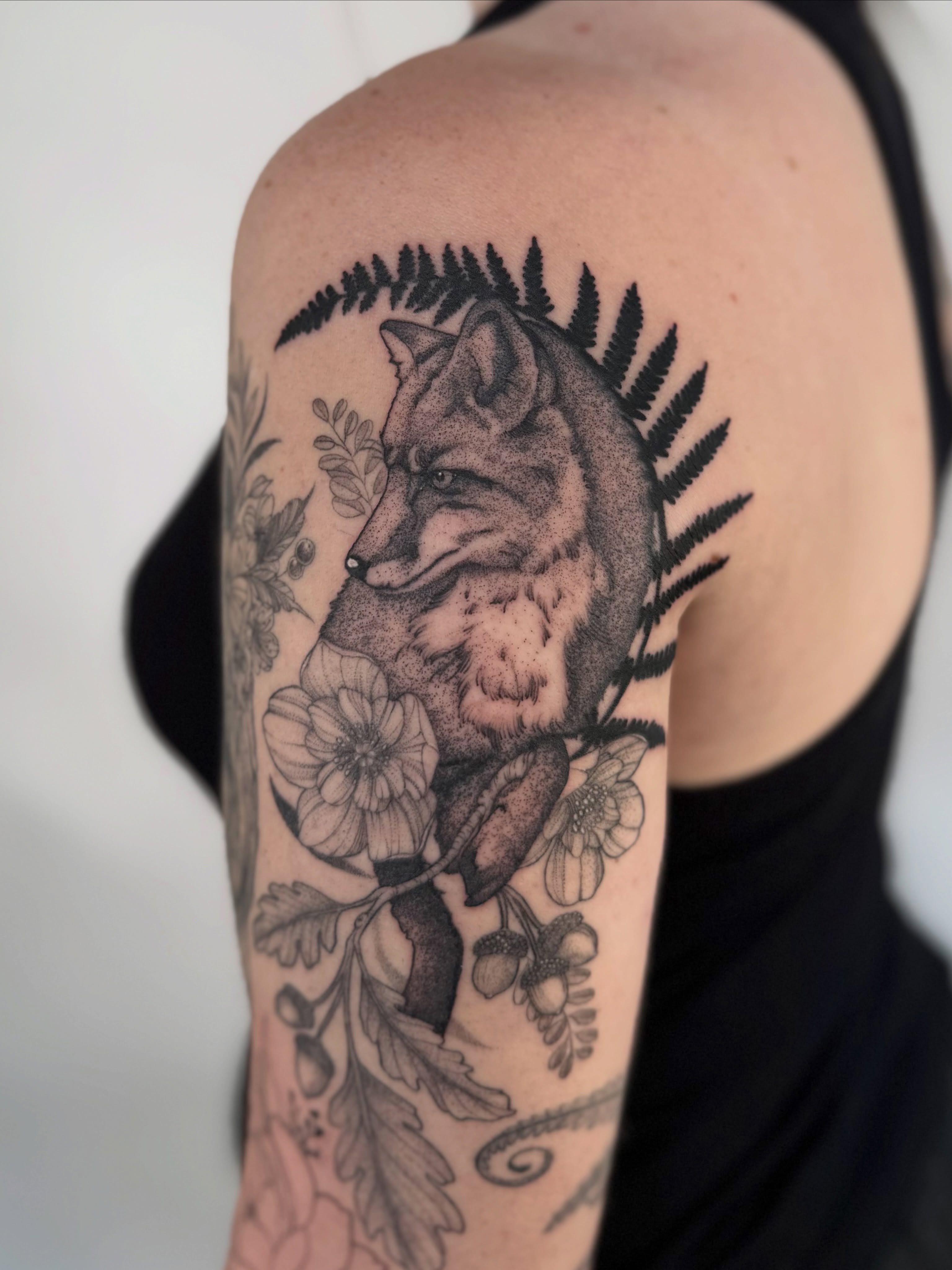 Fox and flowers dotwork tattoo on the shoulder by Jena Perry