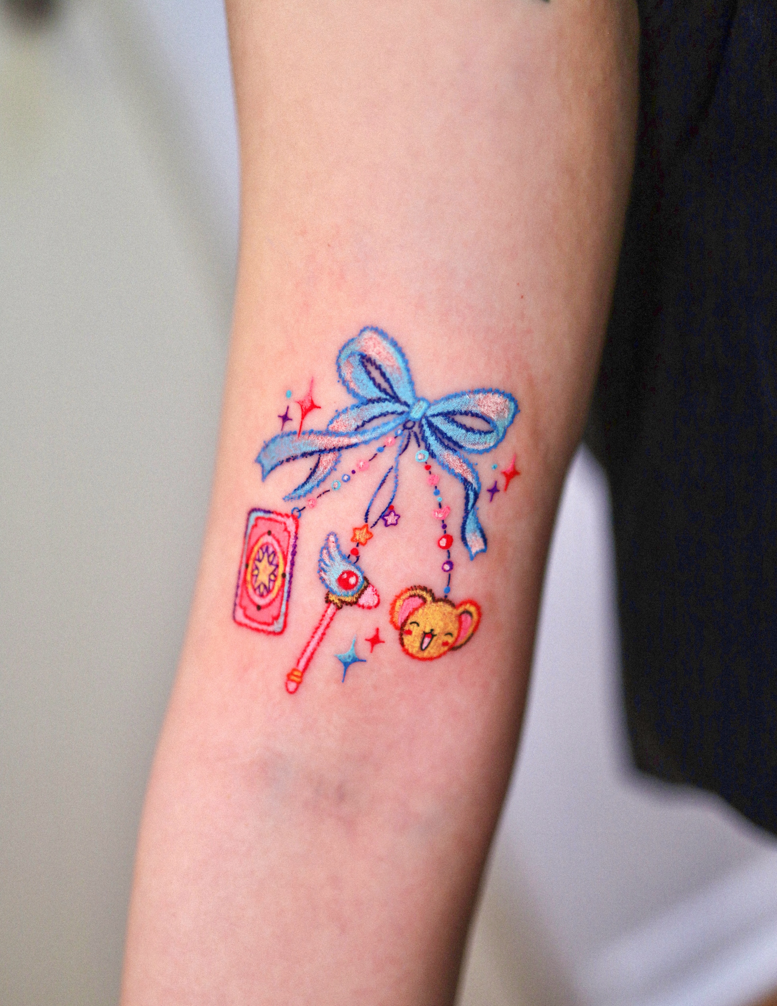 Kawaii-themed items watercolor tattoo on the forearm by Kettle🤍케틀