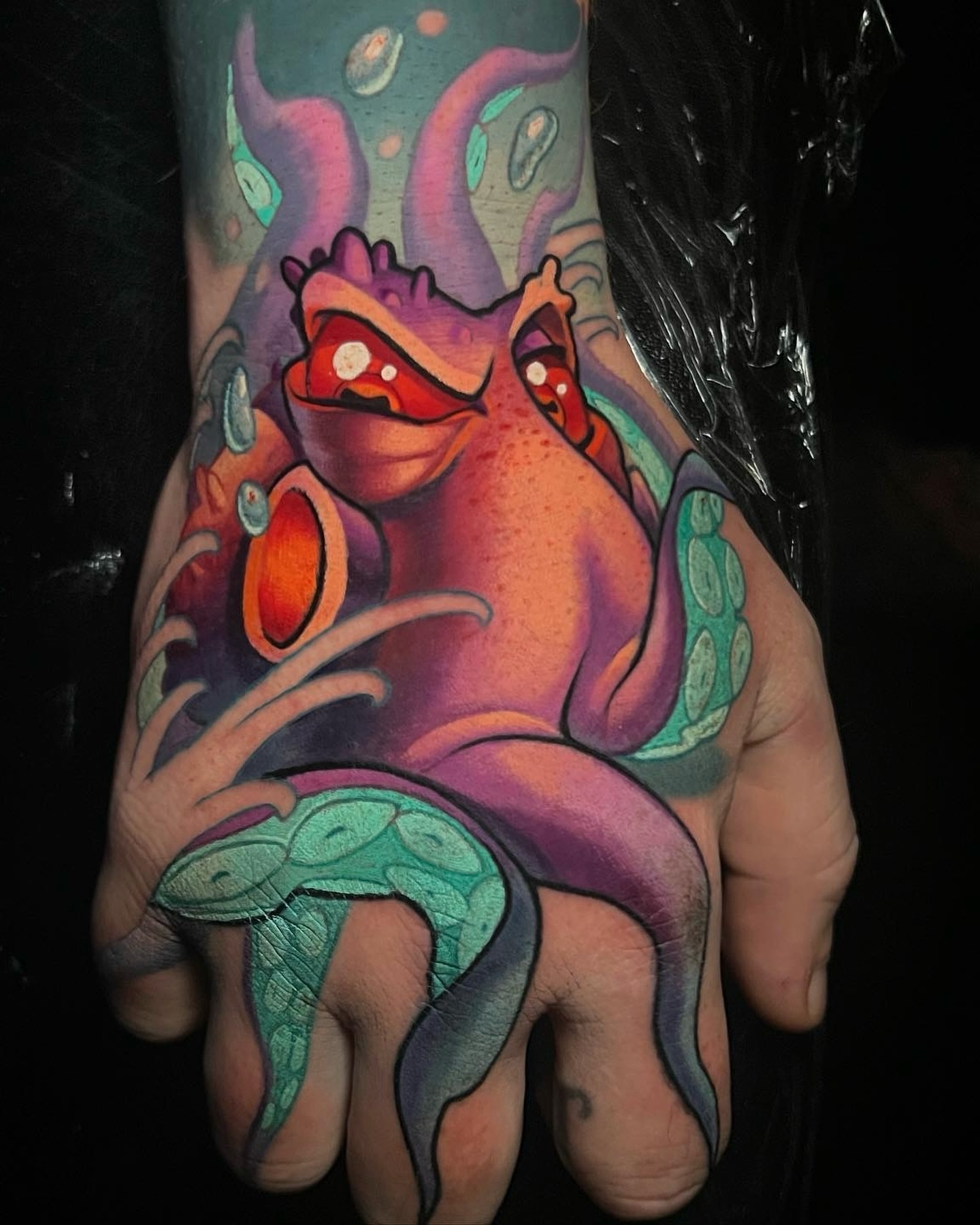 Octopus new school tattoo on the hand by Tim Stafford