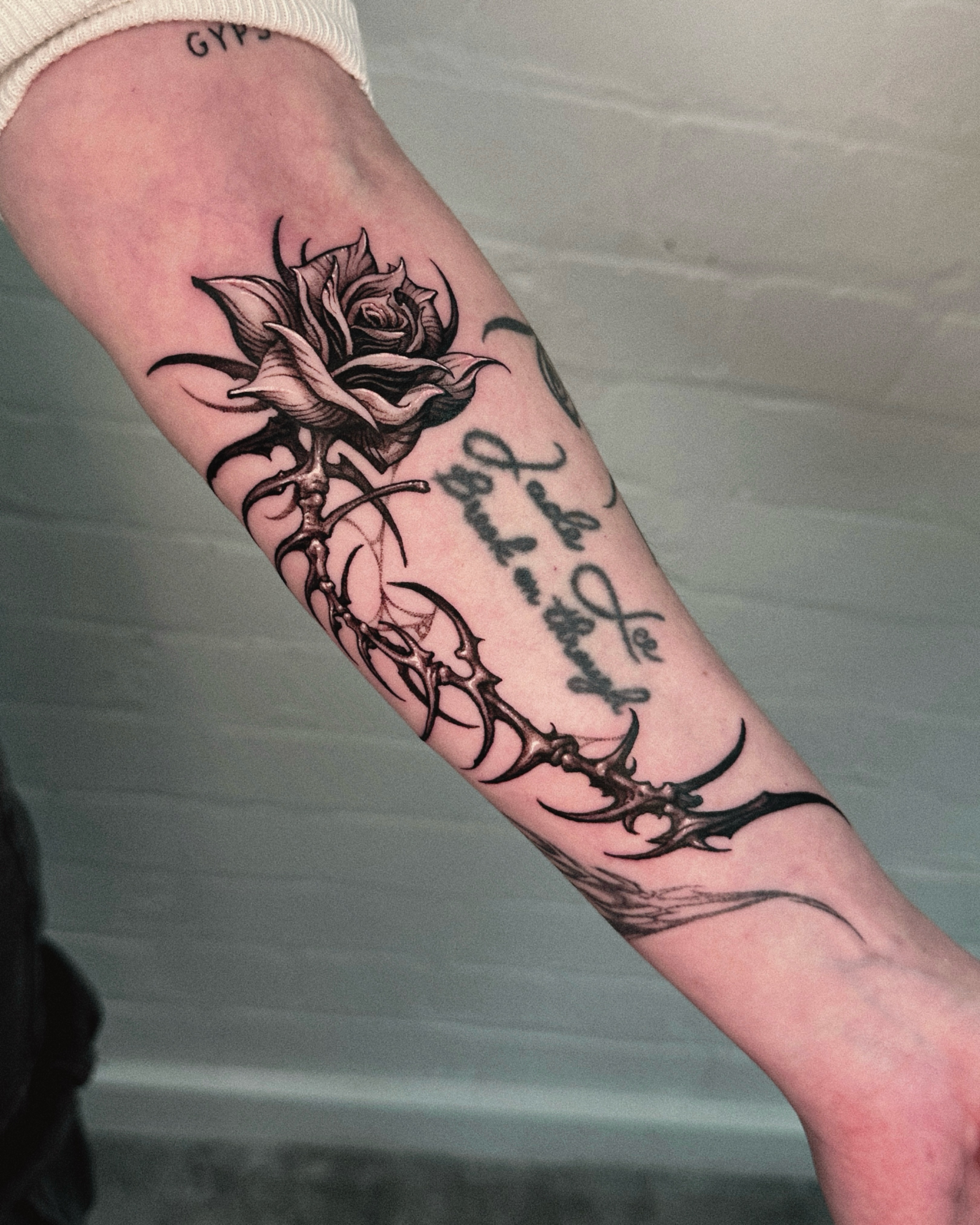 Rose with thorns tribal tattoo on the forearm by 두식