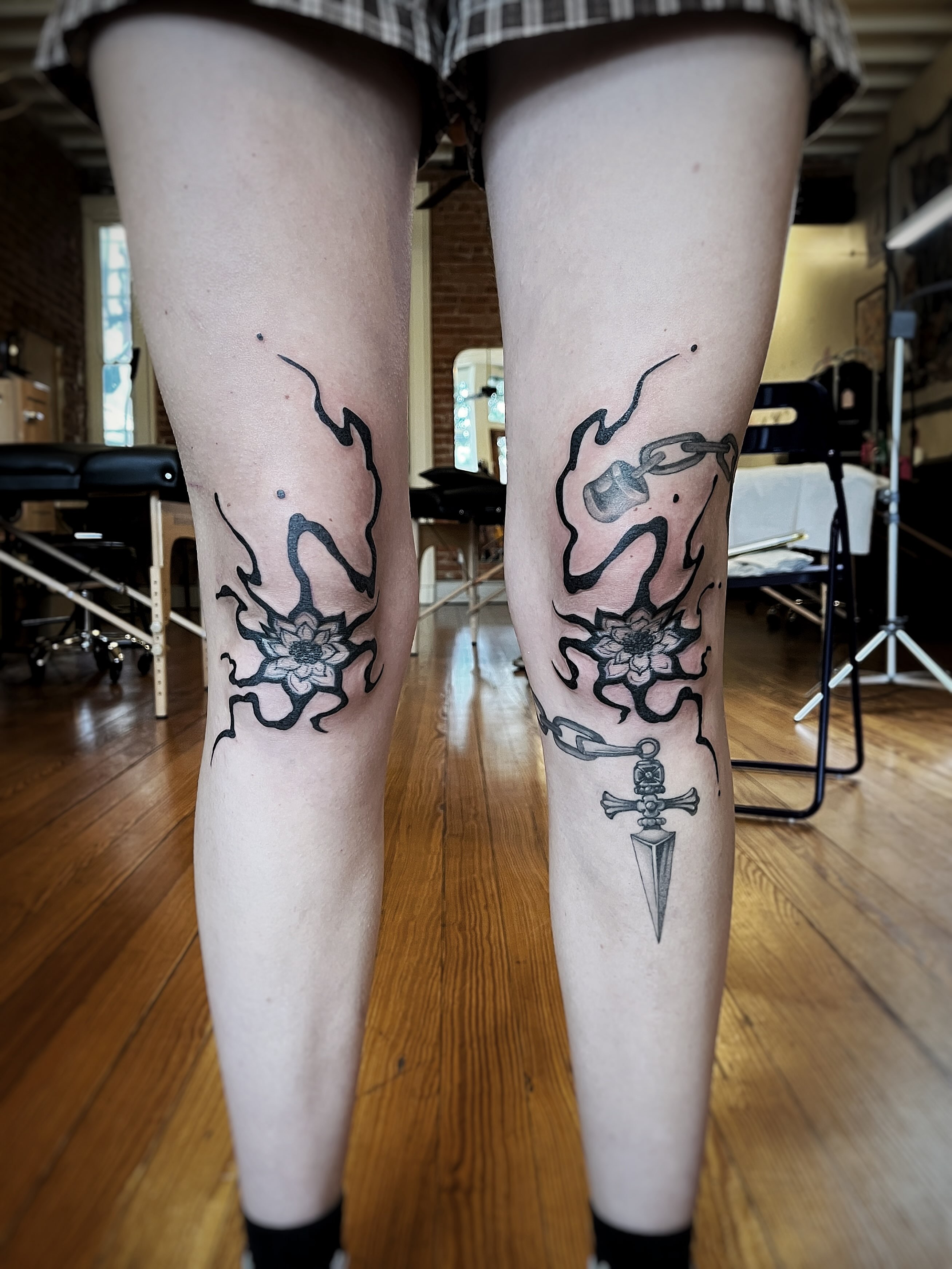 Floral and chain motif geometric tattoo on the leg by Risa Cincinnati Tattoo Artist