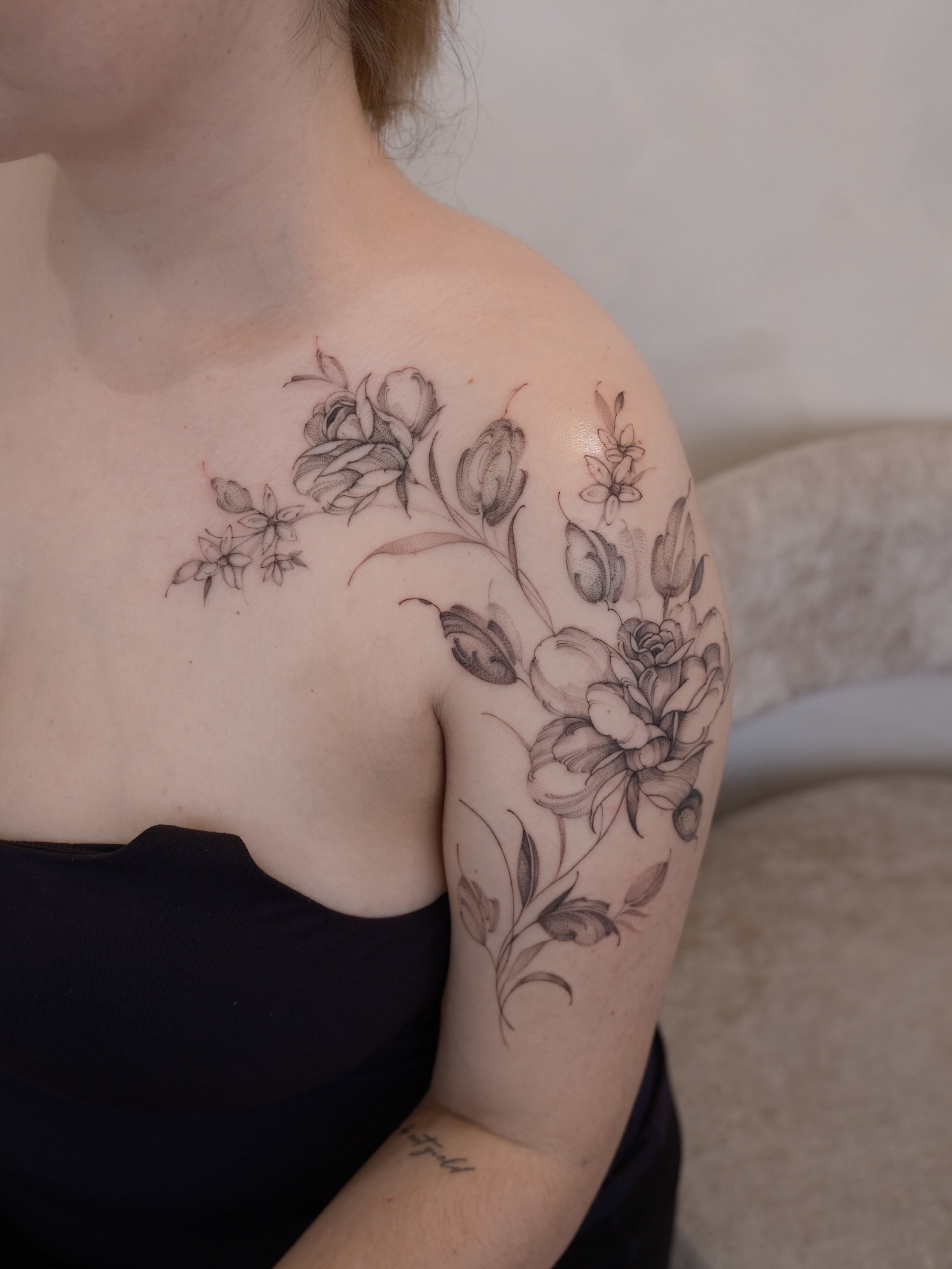Floral arrangement black and grey tattoo on the shoulder by Joy, Gold Coast, Queensland
