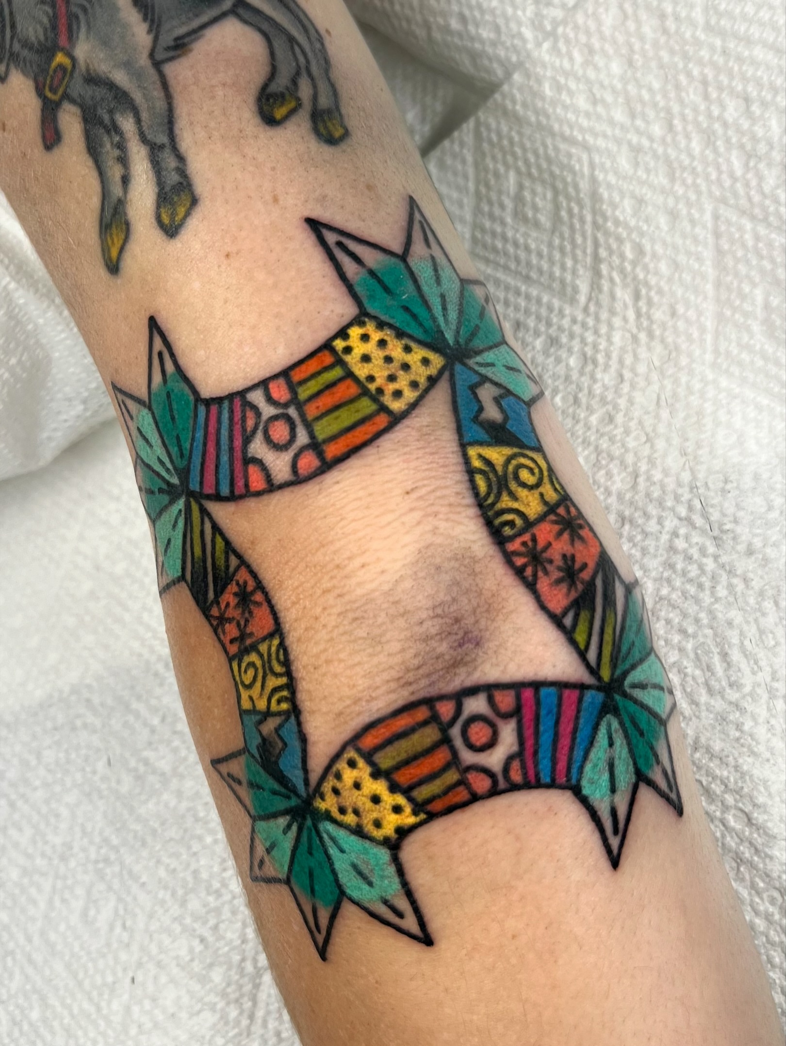 Geometric fox geometric tattoo on the forearm by Sierra Mack