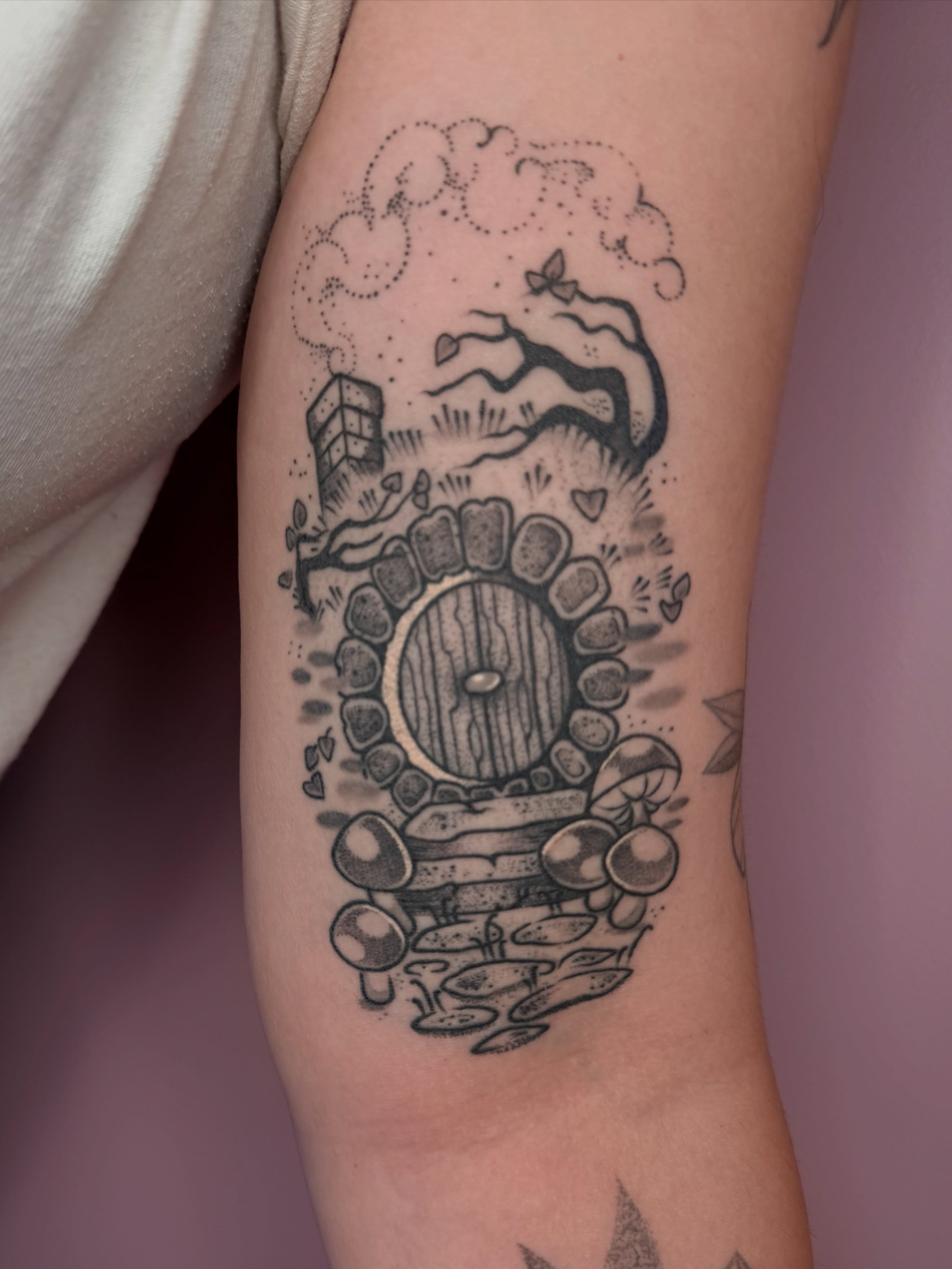Doorway with mushrooms dotwork tattoo on the forearm by Allyson Blessing Tattoos