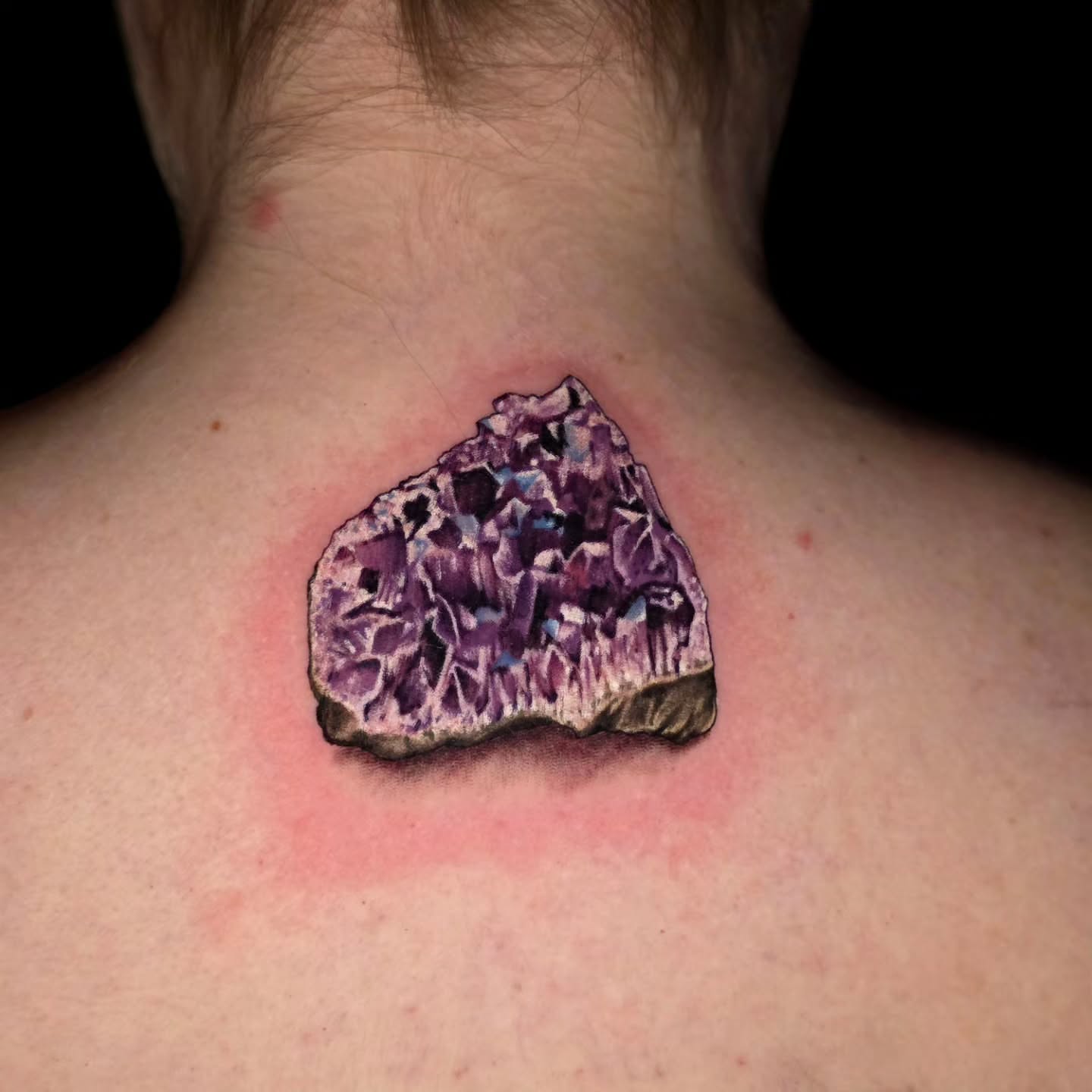 Geode realism tattoo on the back by Banana Cake