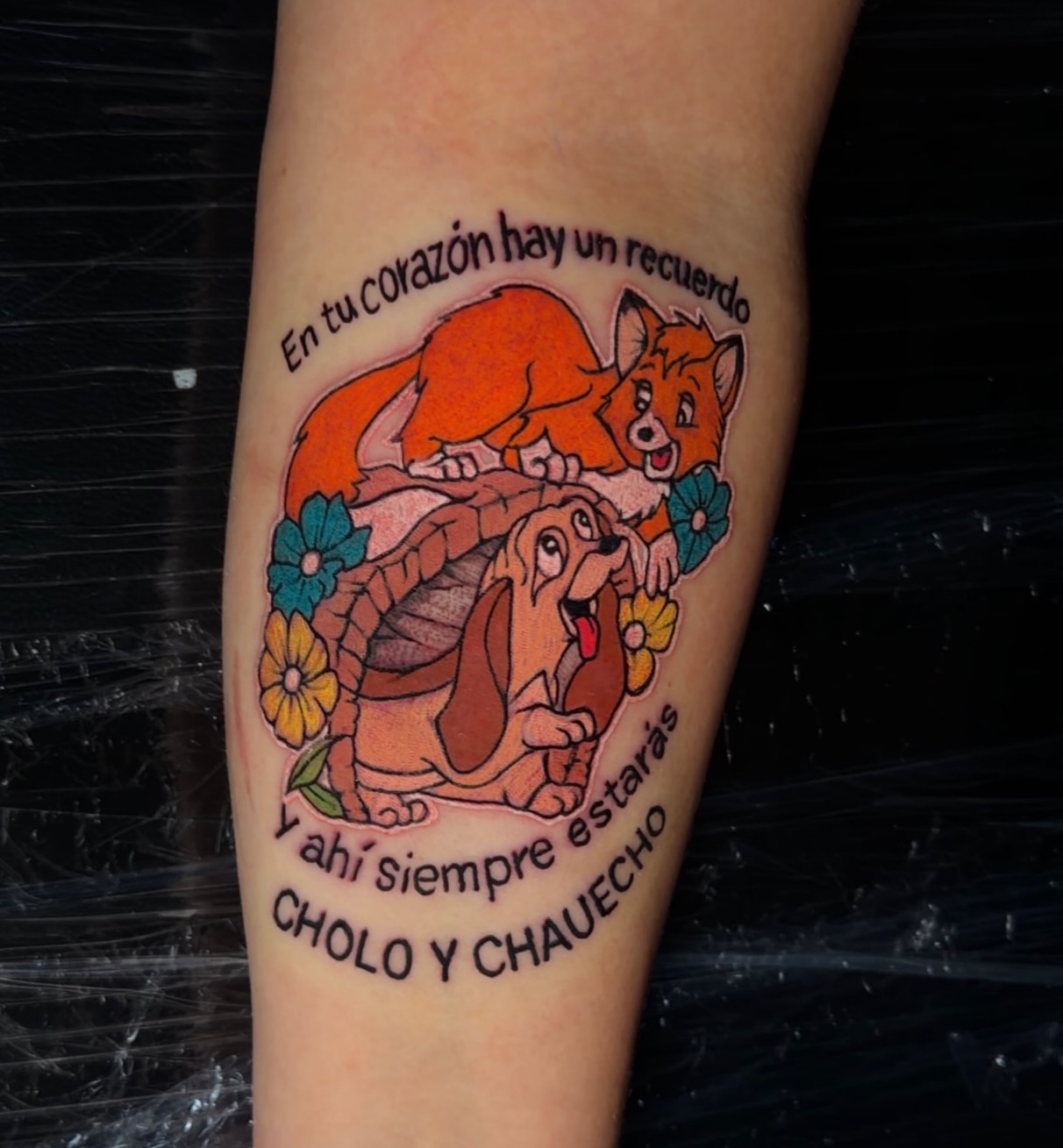 Fox and dog illustrative tattoo on the forearm by Junior Sanchez Dfw