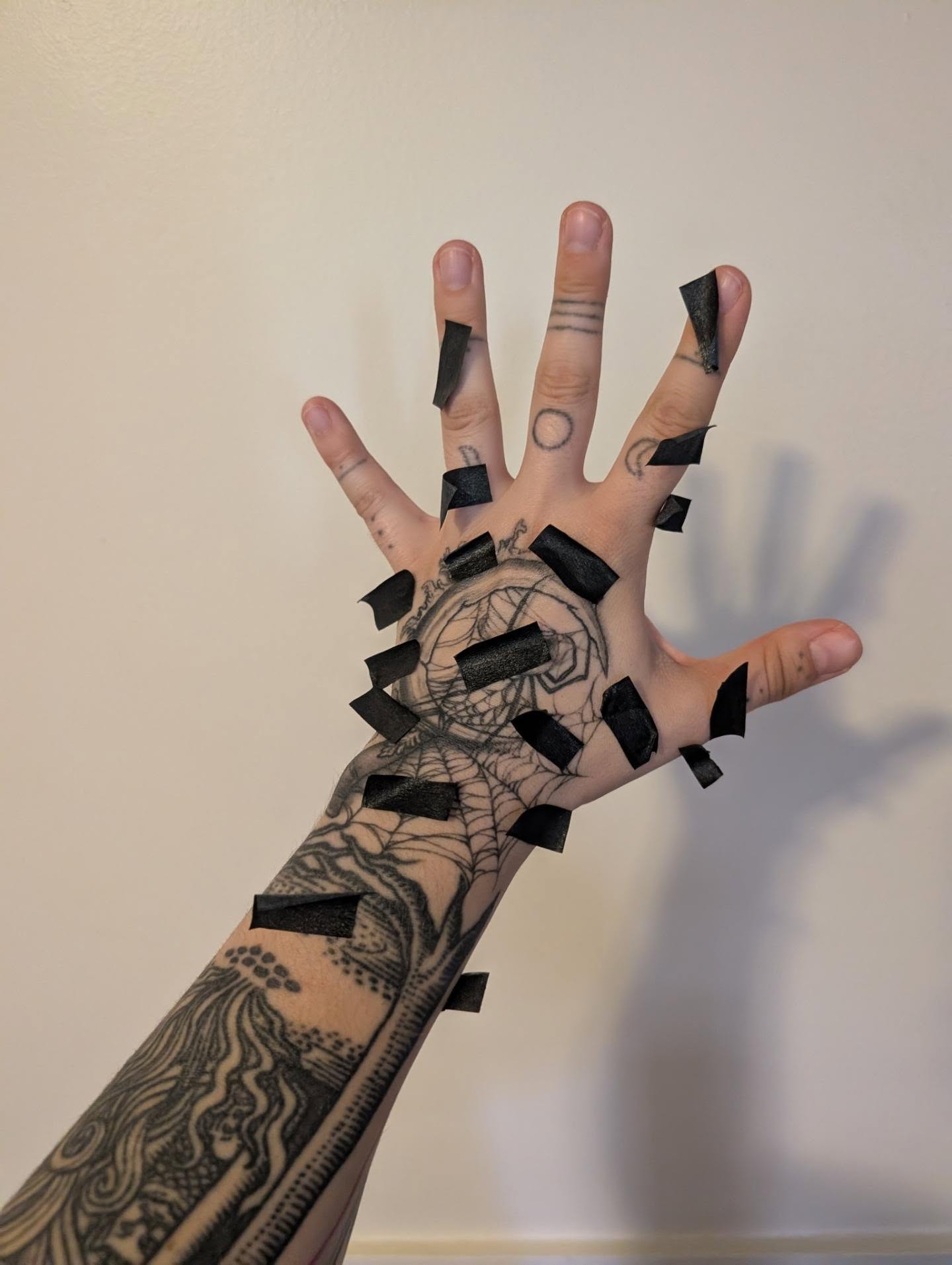 Spider web geometric tattoo on the hand by norn noszka