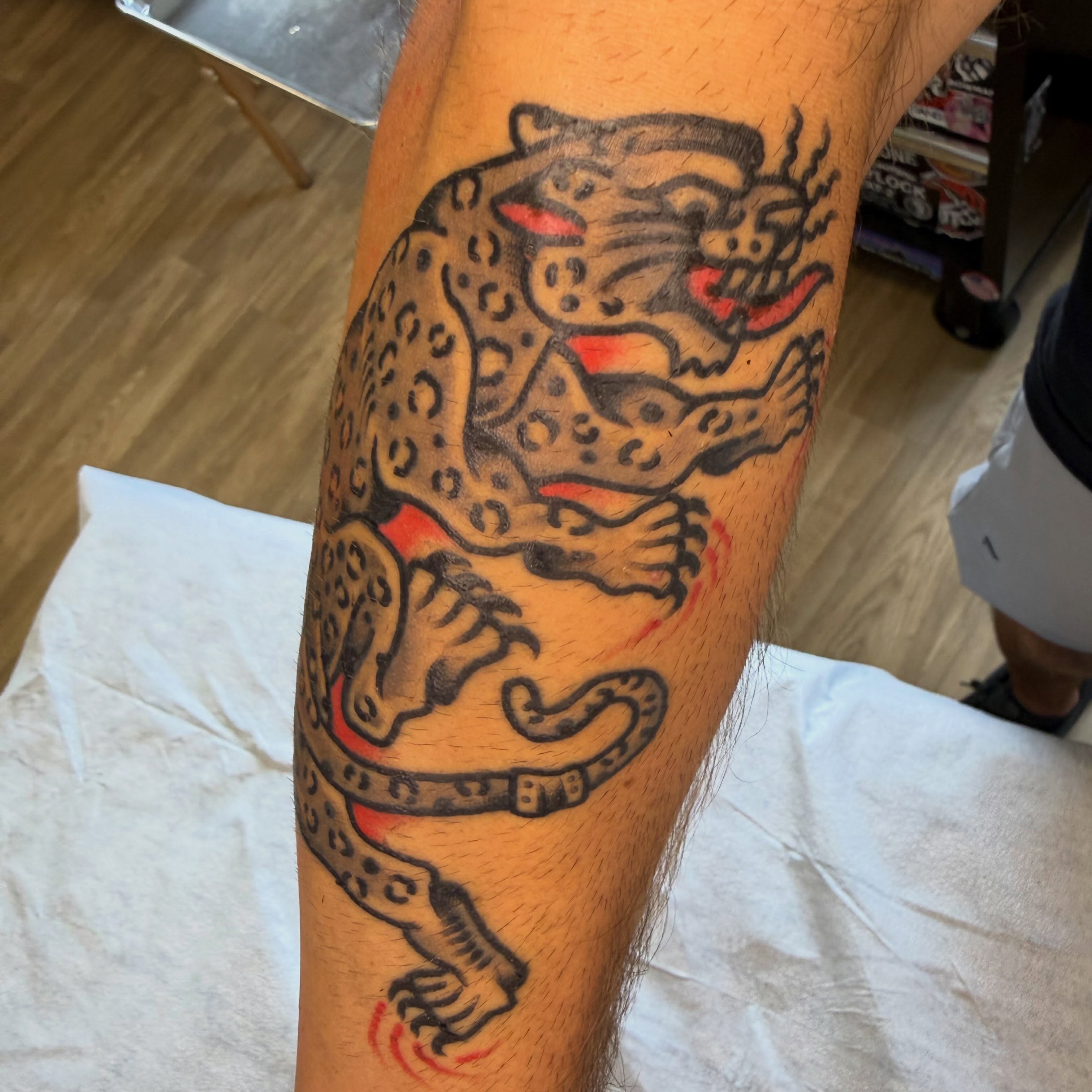 Leopard American traditional tattoo on the forearm by Tyler