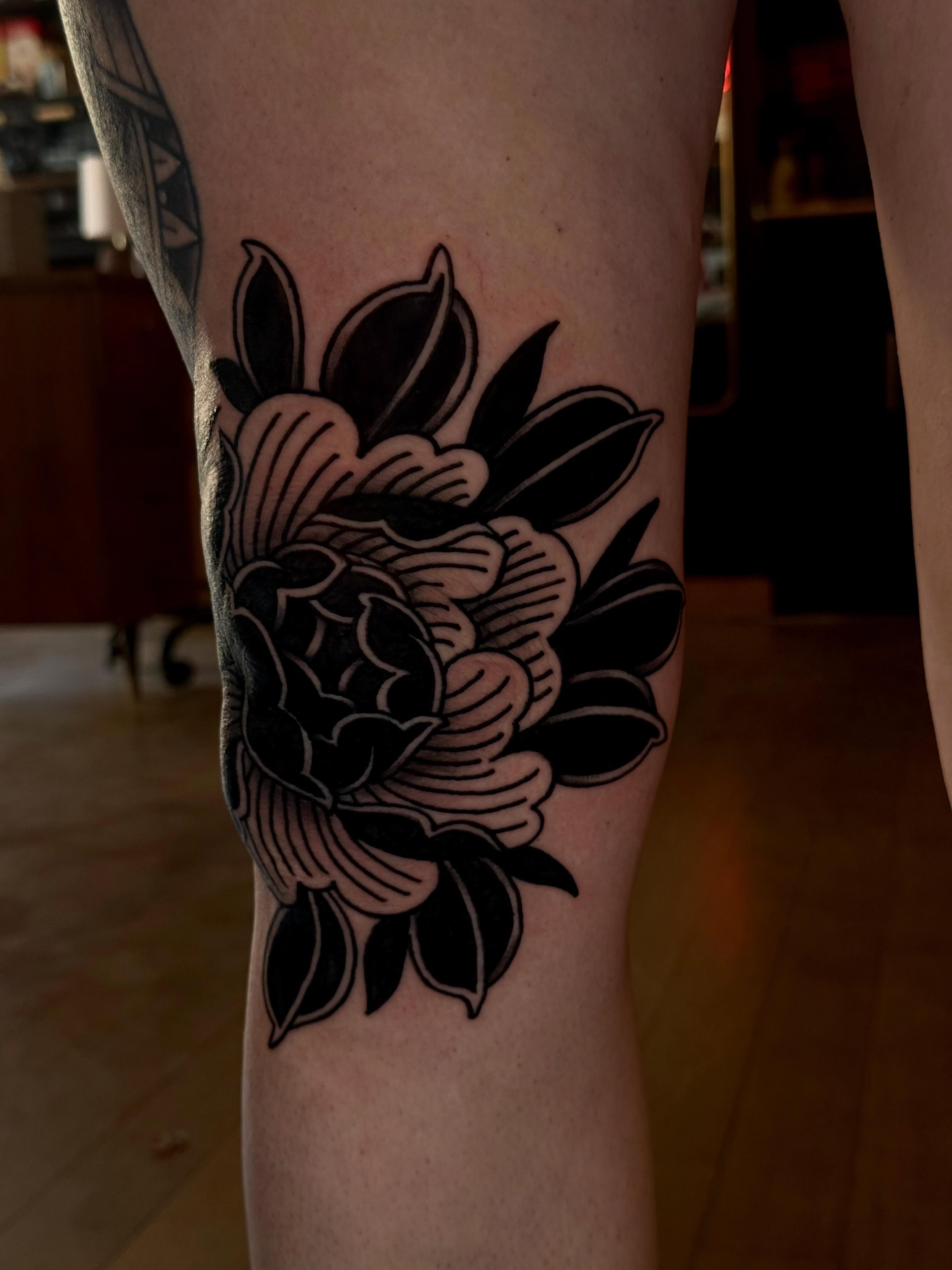 Peony American traditional tattoo on the forearm by Jessica Haug