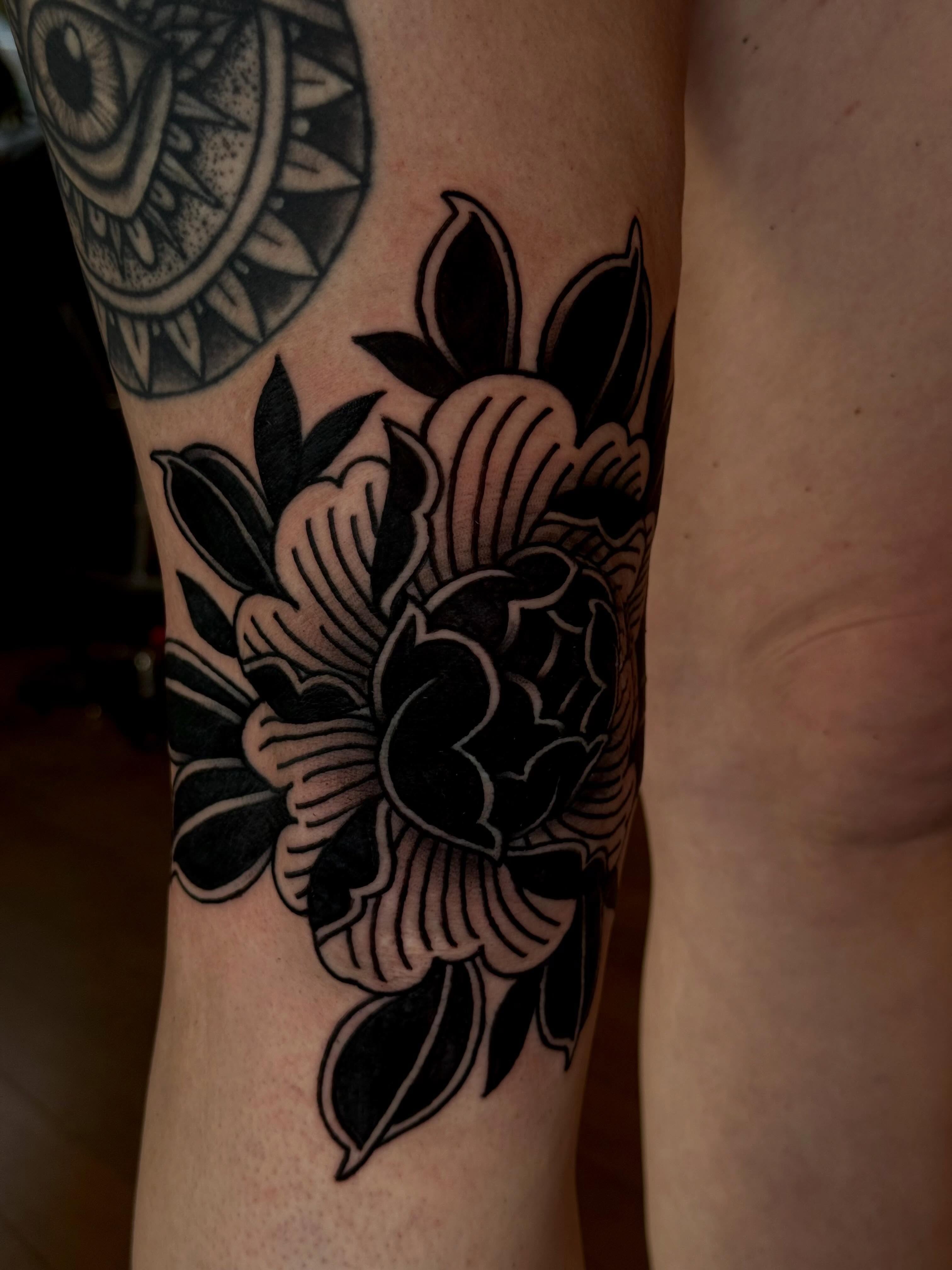 Floral bouquet American traditional tattoo on the forearm by Jessica Haug