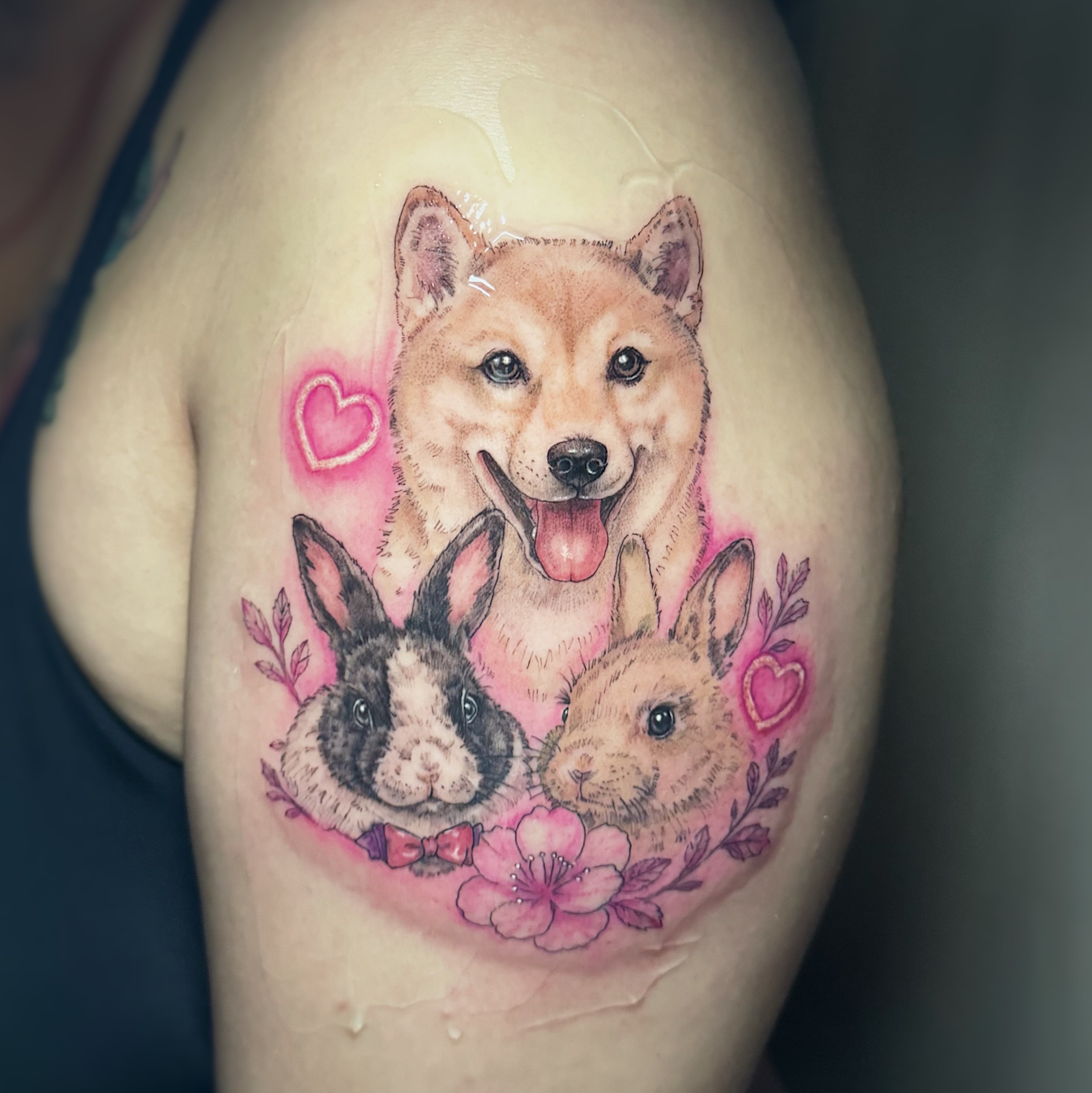 Dog and rabbits realism tattoo on the thigh by 墨匠紋身|新店店, New Taipei City