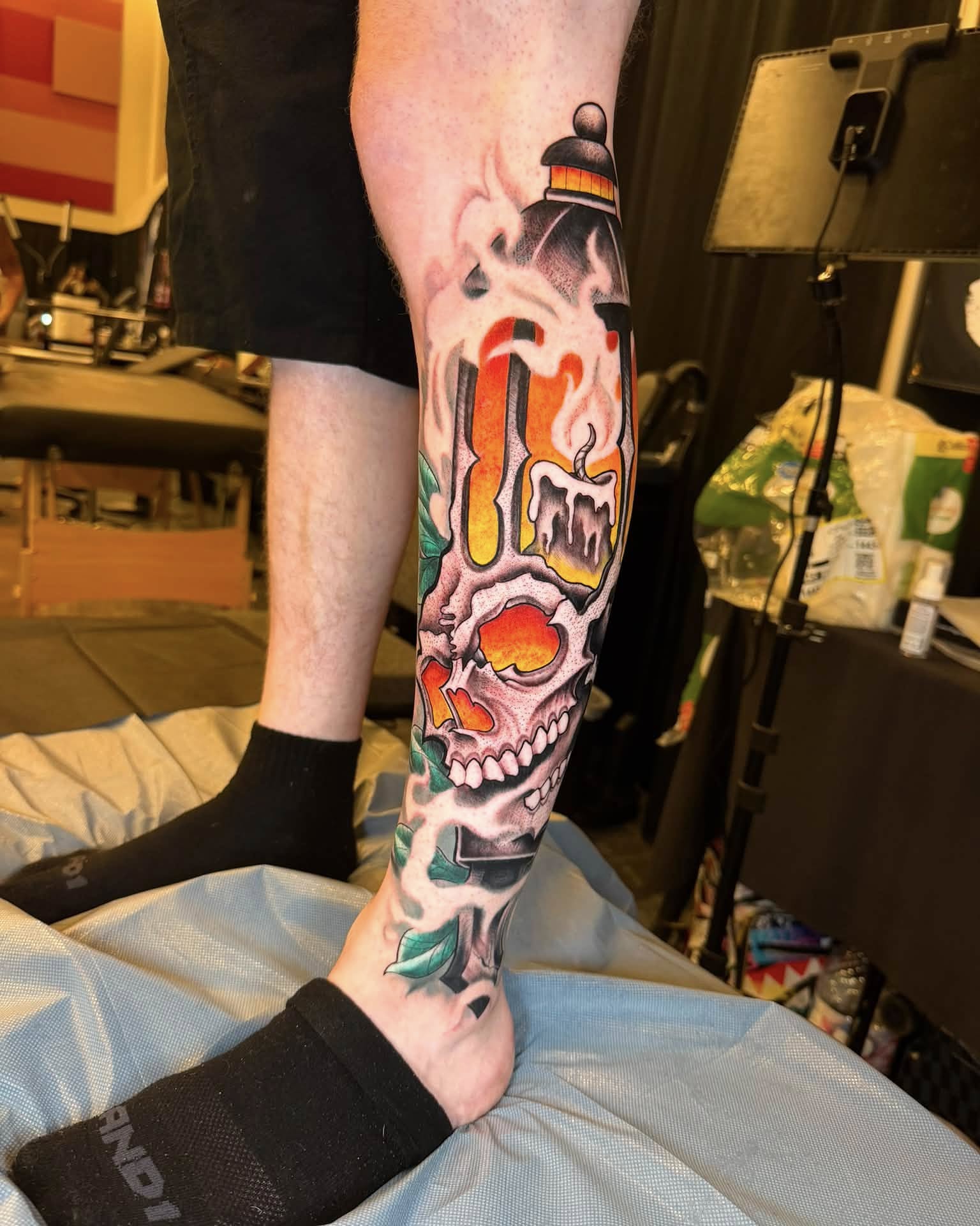 Skull and candle American traditional tattoo on the forearm by Chad Meado