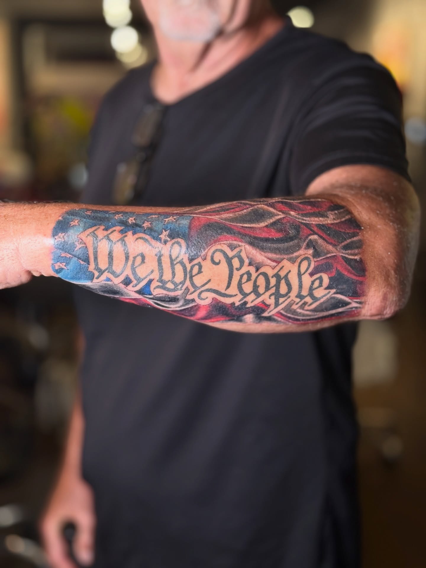 We the People lettering script tattoo on the forearm by Lauren klose, Fort Myers, Florida