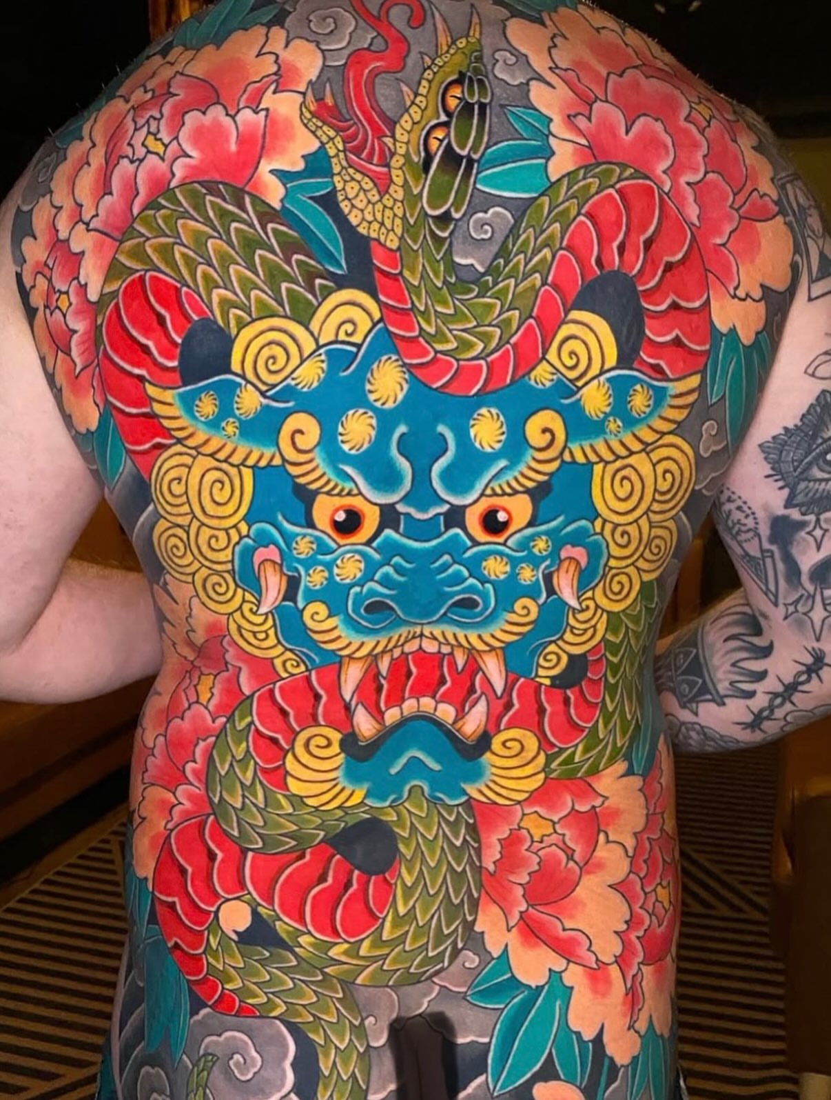 Dragon and floral japanese irezumi tattoo on the back by Mitch Bonifay