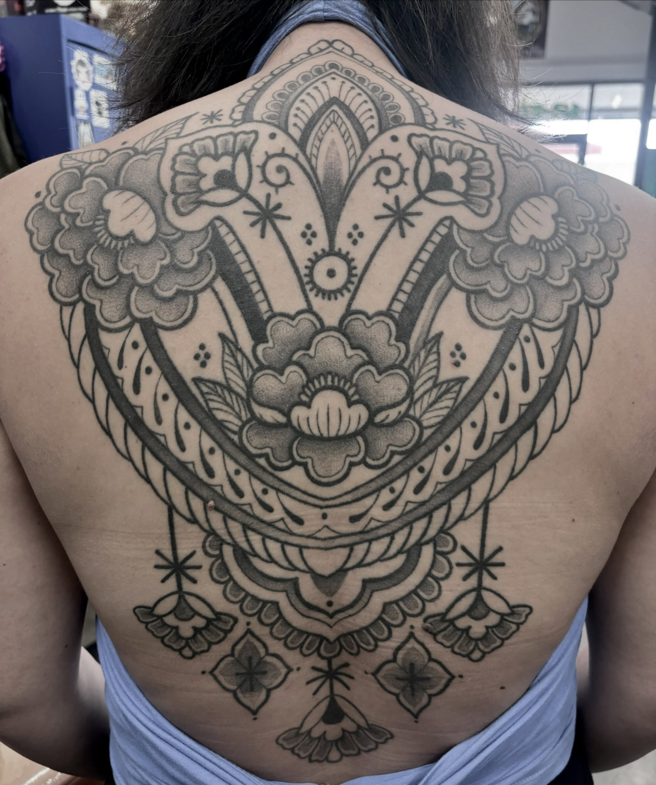 Floral mandala American traditional tattoo on the back by Zoe D