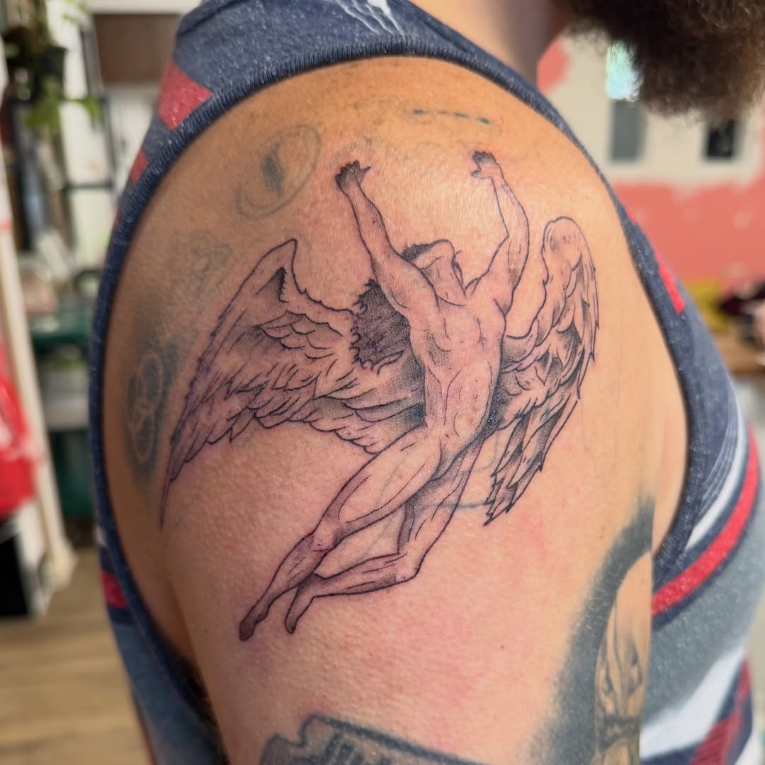 Winged angel black and grey tattoo on the shoulder by Rebecca (Becca) Ray